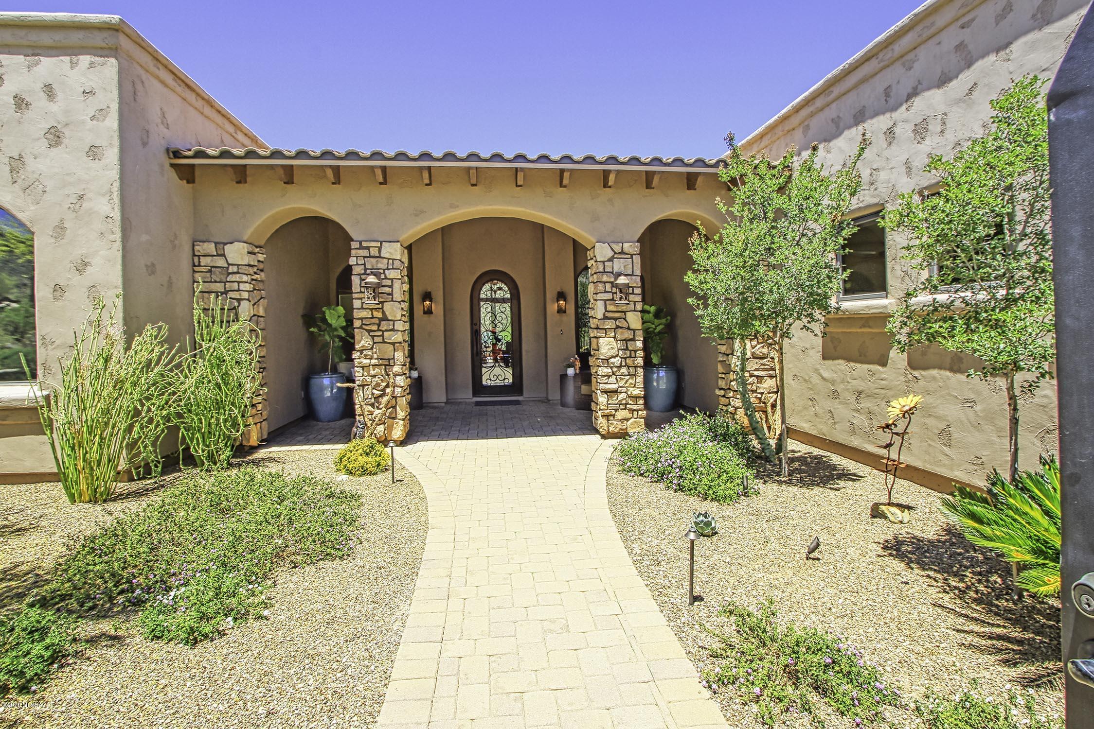 Perched high in the exclusive guard gated Canyon Pass community this gorgeous Tuscan inspired home is loaded with custom upgrades and breathtaking views throughout. Gourmet kitchen is a cooks dream with high-end appliances, beautiful counters and large butler's pantry.  Open to spacious great room with soaring ceilings and fantastic mountain views.  Beautiful travertine tile flooring. Expansive flagstone patio features custom Hayward Omni Logic controlled salt-water pool and spa, upgraded LED lighting, built-in BBQ and firepit overlooking the magnificent canyon.   Luxurious Owner's Suite. Full Media Room (could be 4th bdrm). Oversized 3 car garage w A/C storage area. Some home furnishings available with purchase. This is a stunning home not to be missed!