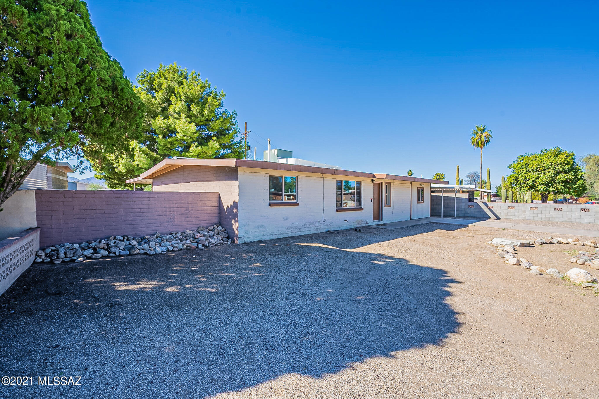 Ready for it's new owner! This spacious 4BR/2BA home has bright new interior paint and carpet and an open floorplan! Bonus/family room has French doors that lead to a generous sized back yard with masonry walls and storage shed. Other great features include: dual pane windows, SS side-by-side fridge, skylights & covered parking! Convenient to shopping, restaurants & public transportation. Come check it out!