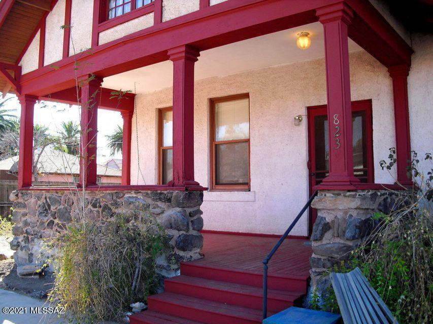 Historic Tudor Revival style property in the iconic West University neighborhood. The Vail House estate is currently an income-generating 7 unit property (4 unit house and a tri-plex on separate tax codes). The property boasts refinished hardwood floors, original wood trim, antique light fixtures, historic tile in the original kitchen, large bay window, two front porches, and is bursting with potential. The property could easily be converted back to its original grandeur, utilize as a standard B&B or AirBNB, or simply raise rents (rental rates are soaring in Tucson) and enjoy the cash flow. The lot is large enough to build an additional 4-plex or SFR. Triplex rents are (2) 1br/1ba at $775 and (1) Studio/1ba at $700. **SELLER FINANCING available with 30% down.