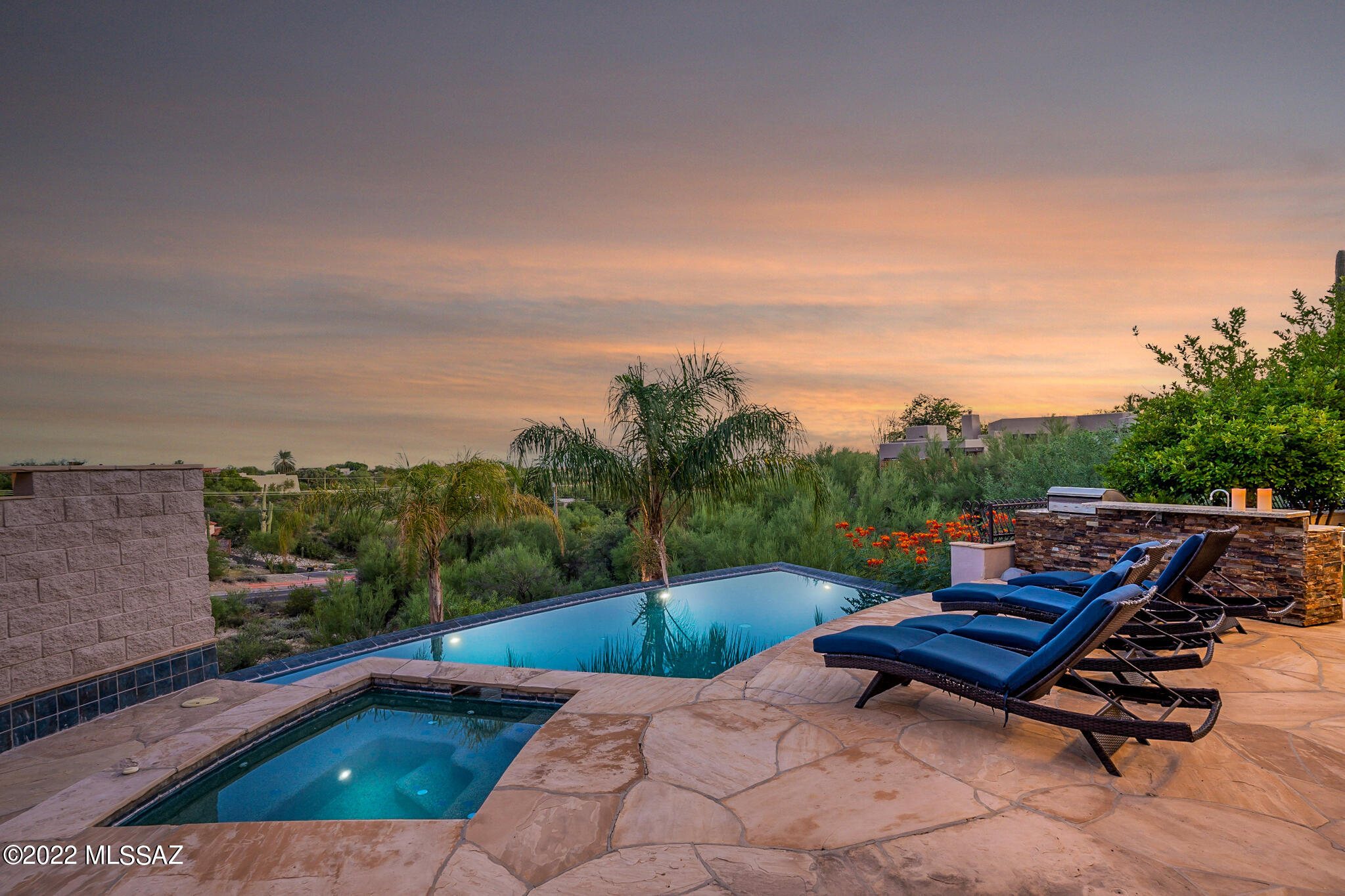 Located in the Heart of the Foothills on an elevated lot, with views of the Catalina, Rincon and Santa Rita Mountains, along with City lights, Prestigious Eleven Arches neighborhood. A stunning Home features 6 Bedrooms, 6 Baths, expansive Great Room, Dining area, Family Room with incredible Views, a very Grand Gourmet Kitchen, Oversized Breakfast Bar, Pre Island, 2 Ovens, 2 Dishwashers, Subzero Fridge and Separate Freezer, Beverage Fridge, Viking Appliances, Hidden Butler's Pantry, large Laundry Room, your very own private Elevator off the Main level to the Recreation area, with Kitchenette, Indoor Resistance Climate Control Exercise Pool, Exercise Room, Steam Shower Bathroom, Theater with Projector and Seating, Primary Bedroom Suite on the Main Level with retractable window Blinds,  Gas Fireplace, Custom Bathroom Mirrors, Dua Vanities jetted soaking Tub, Personal office off the Primary Bedroom with exit on to the wrap around Patio, Water filtration System, Negative Edge Pool and Spa. All Bedroom have exit on to the Patio or grounds. A well designed home.