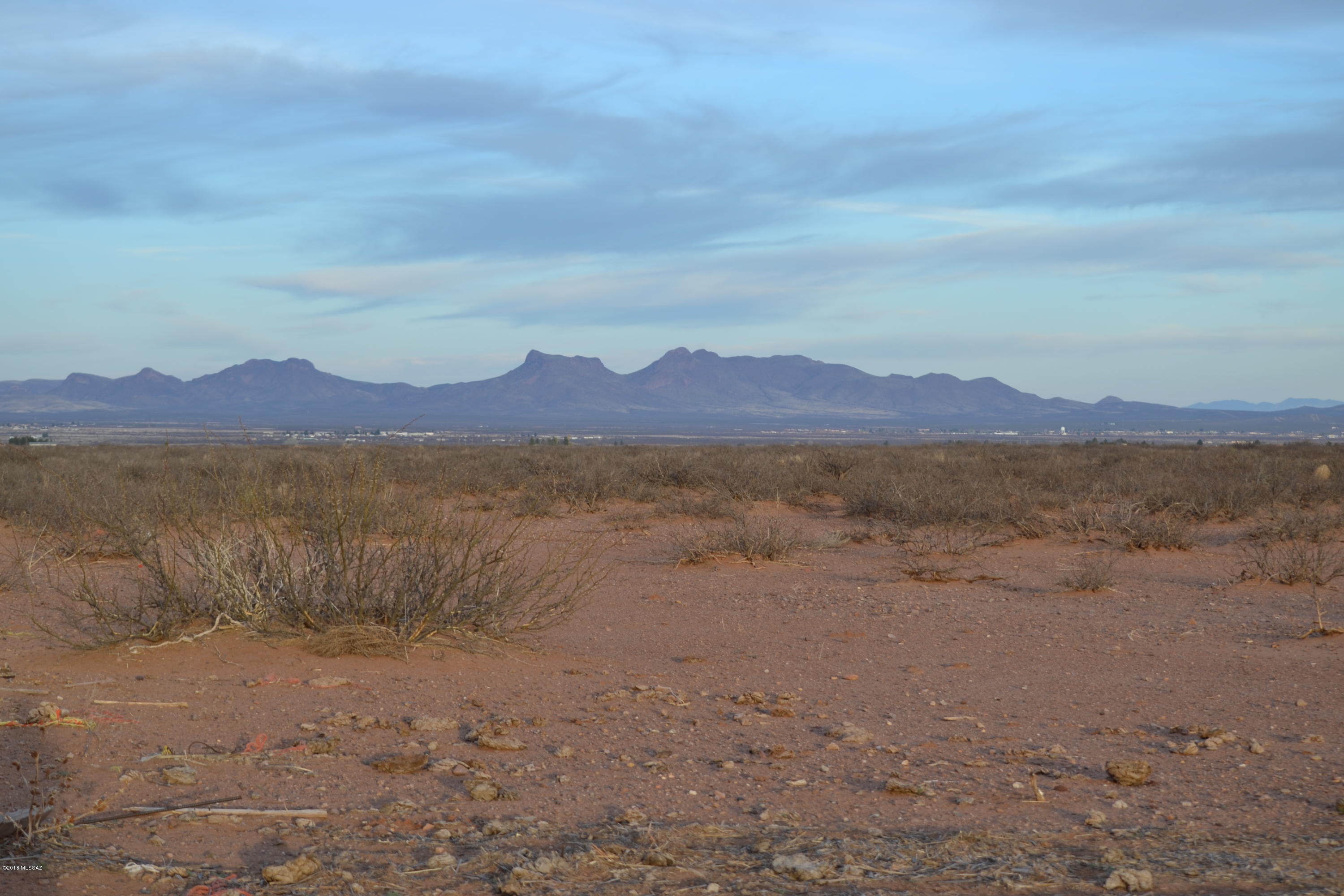 203 acres of level, flat land for you to bring your ideas to. Wanting lots of privacy, maybe a ranch? Don't let this one slip by you. Lovely views of
the mountain ranges, off of a paved road and close to highway access AND power on the property line! Sale includes 3 parcels and one parcels borders state land!