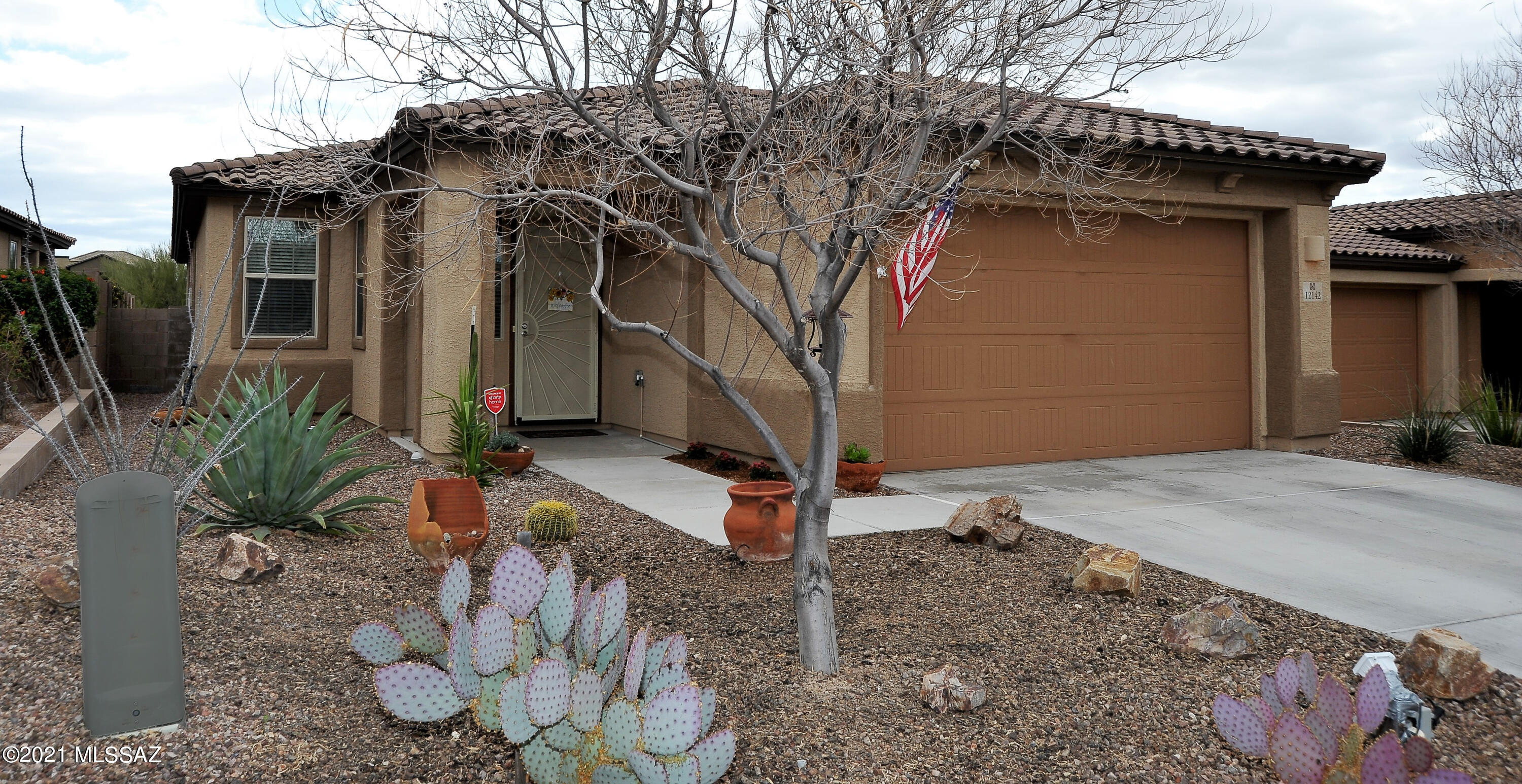 Good as new 2014 built Richmond American home in gated Preserve.  Great room concept with tile floors, gas fireplace, high ceilings. Gourmet kitchen has double ovens, granite counters, espresso cabinets, gas range, over the range microwave,  all stainless appliances and the fridge stays. Laundry room off garage has sink, espresso cabinets and the washer and dryer stay. Split floor plan has 2 guest rooms with full bath in the front of the home and master suite in the back of the home. Master bath has double vanity, soaking tub, separate shower and walk in closet. Ceiling fans throughout the home. Backyard faces east and backs to natural desert. Covered patio extends into a pergola that has grapevines growing in the spring and summer. Peaceful retreat with fruit trees and trickling fountains