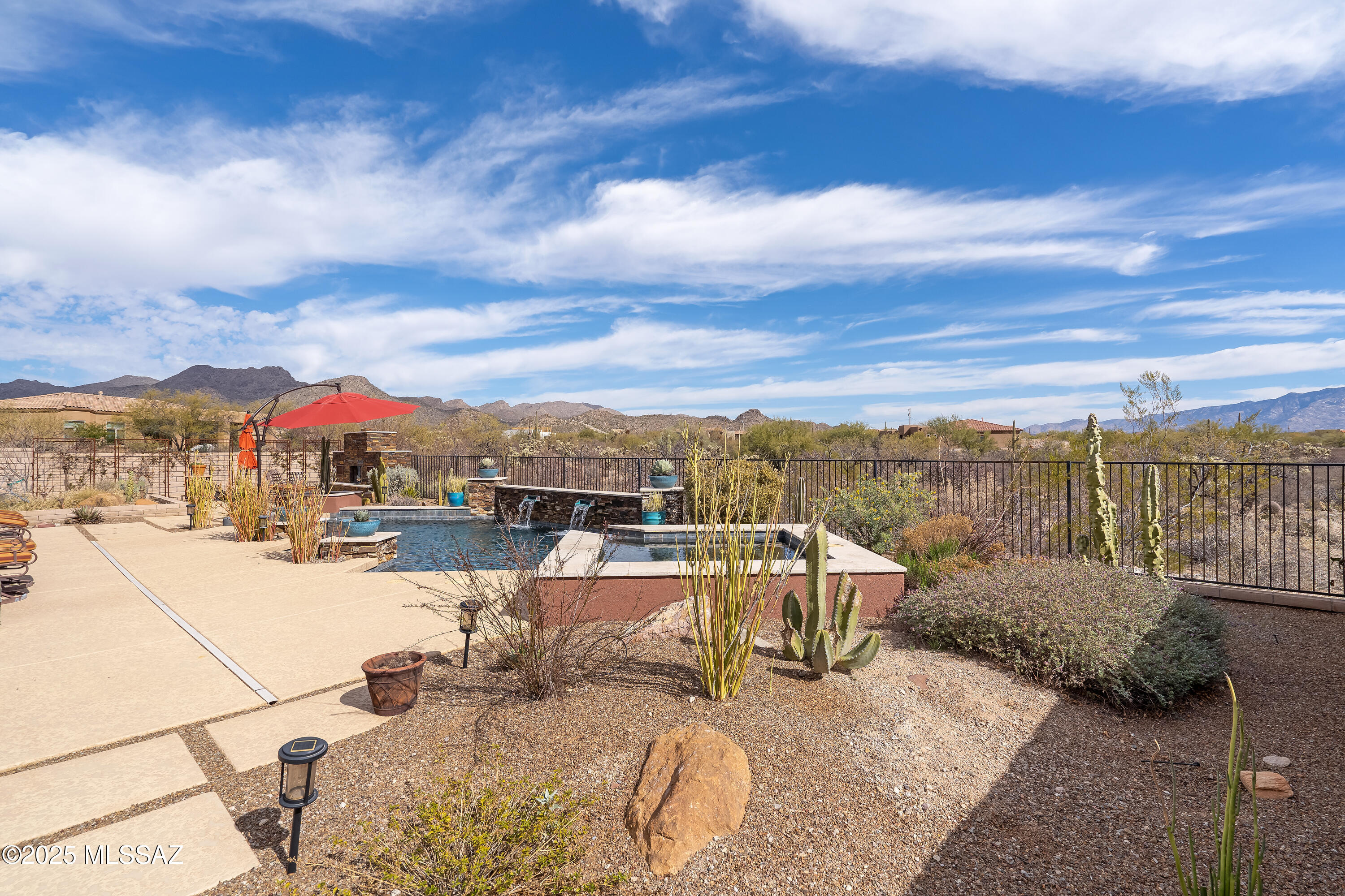 VIEWS, VIEWS VIEWS! A spectacular Tortolita Vistas gem on an acre plus cul-de-sac lot situated so that you can enjoy two magnificent mountain ranges.  Relish Luxury living against the breathtaking backdrop of the Tortolita/Catalina Mountains in the highly sought prestigious gated community of Tortolita Vistas. Stunning 2012-4BR/3 1/2BA 2878 sq ft entertaining & energy efficient home is turn-key! Home features a split-floor plan w/an abundance of tile throughout, gourmet kitchen w/gorgeous granite, center island, large breakfast bar, cabinets with pullouts & SS appliances. Large Great Room with fireplace. Separate formal dining and a Large Flex Room for hobbies/family room. Spacious primary suite with patio access has a luxurious master bath with custom walk-in shower and two master closets. Delightful guest rooms, one is an ensuite. Spacious 3 car Garage. Revel in the salt-water, solar heated pool, or sitting by the cozy fireplace enjoying the gorgeous sunset & mountain views adding an extra layer of serenity and prestige to your living experience. Restaurants are a golf cart away to enjoy live music and delicious dining. Access to several 5-star golf courses with Ritz Carlton, Gallery, and several more social or athletic memberships ensure unmatched leisure. Don't miss the opportunity to make this your forever home and experience the ultimate blend of elegance, comfort, and convenience.