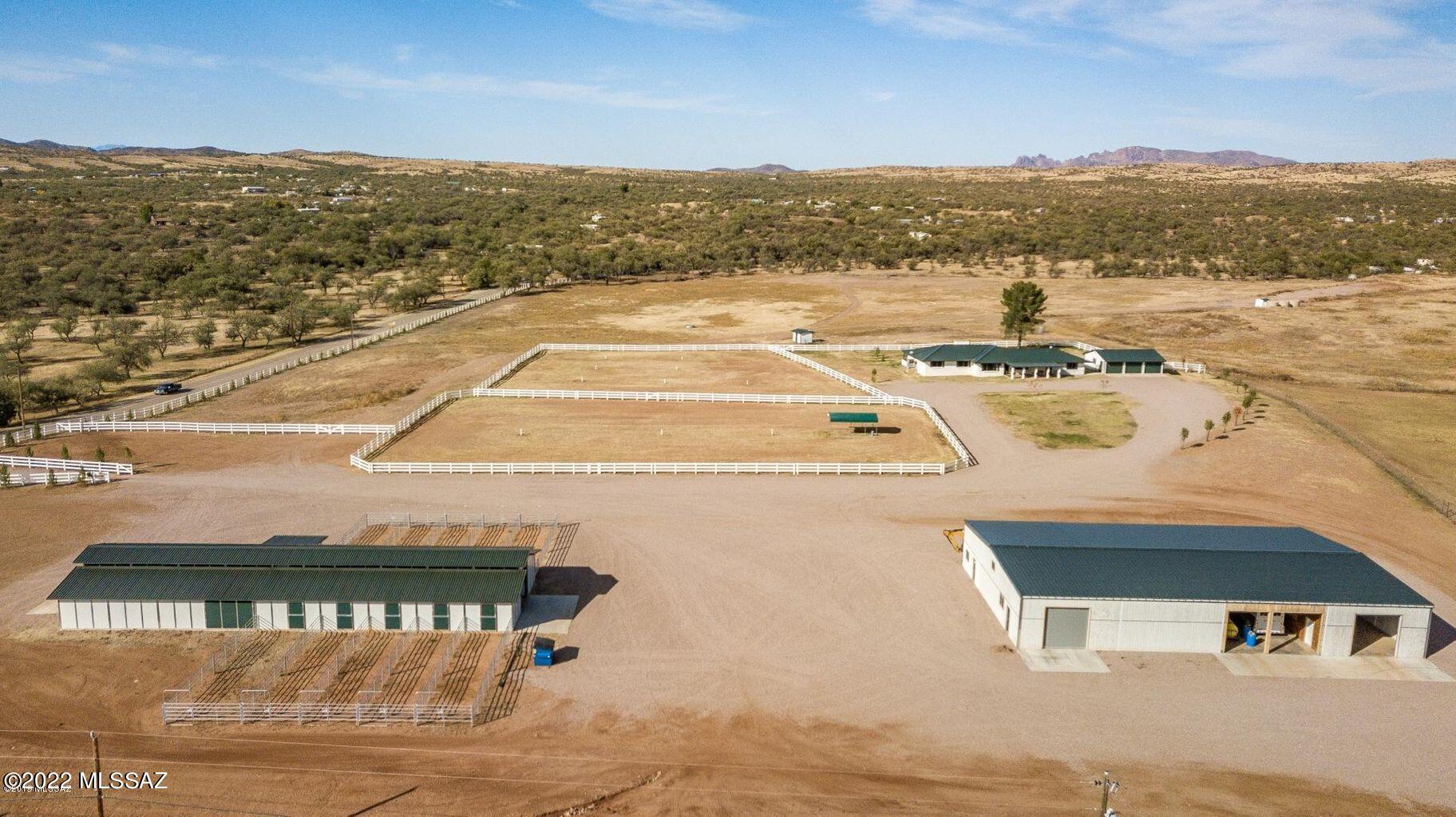 Horse Lovers Dream that sits on 39 acres, of which 10 are irrigated and newly planted. The home has had extensive updates to it with tile floors, a master suite with a walk-in tub and an attached Mother-In-Law suite with its own entrance. A new oversized 3 stall garage. The horse barn was built in 2017 with 10 rubber matted stalls, automatic waterers that all lead to their own 12 x 40 runs. There are 2 wash bays, a tack room, washer and a supply room. The Shop & Storage building that was built in 2018 is 60 x 100 with steel frame construction, cement flooring and ample room to finish the apartment inside. The property is fully fenced with white vinyl fencing on 2 sides. No climb fencing on 10 acres that is irrigated and 2 wells. This is a MUST SEE HORSE PROPERTY!!