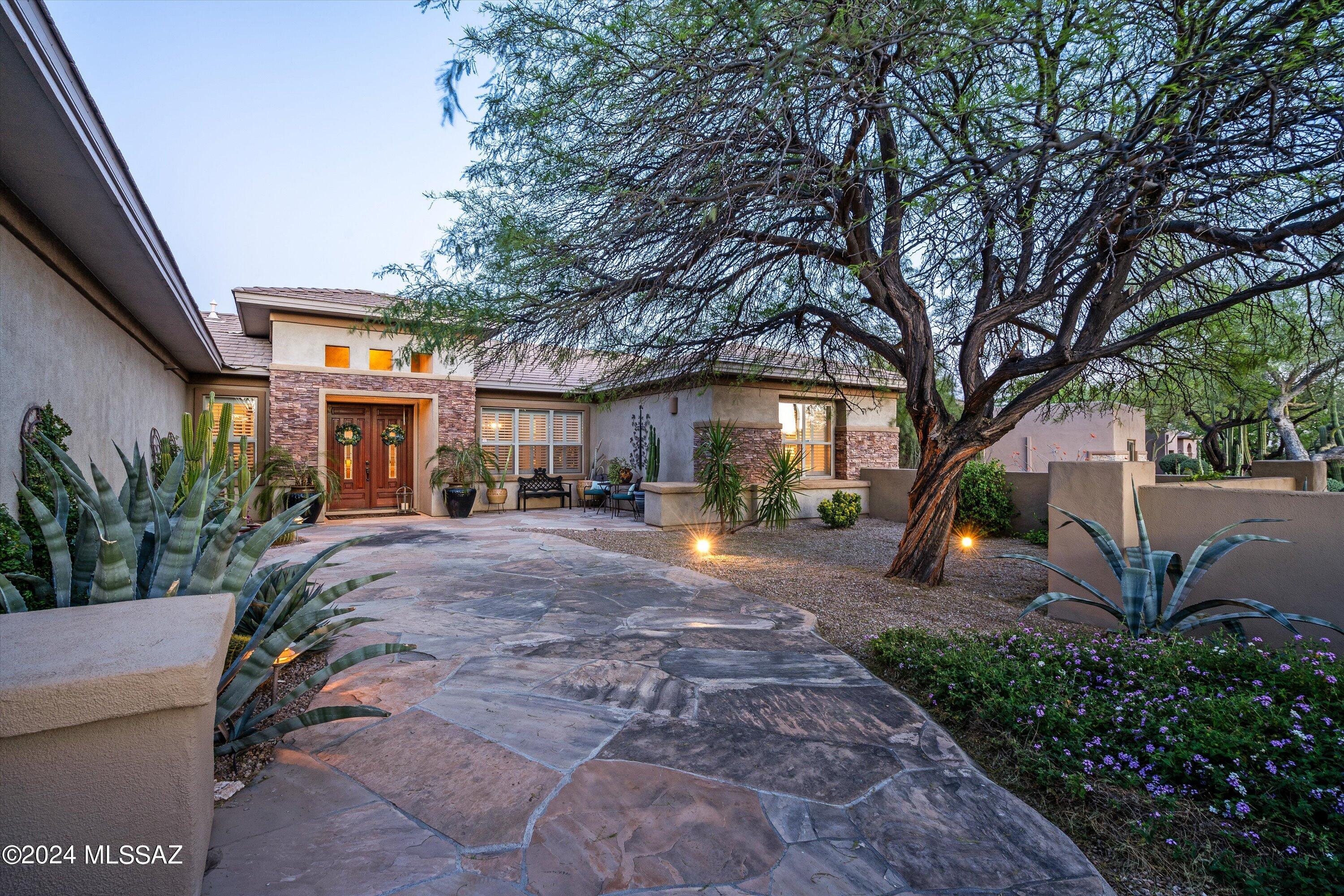 Meticulously maintained! Get ready to discover the perfect blend of luxury and comfort in this gorgeous home located within a gated enclave of Oro Valley's Rancho Vistoso. Offering panoramic views of the Catalina Mountains, this property boasts:** 4 bedrooms plus a guest suite, providing ample space for family and guests ** Owned SOLAR **A spacious kitchen featuring custom cabinetry, granite counters, large island and top-of-the-line GE Profile appliances and a warming drawer** A relaxing family room with a gas fireplace and built-in cabinets**An office/den with built-in cabinets and dual desks, perfect for work or study**A primary bath equipped with a jacuzzi tub, walk-in shower, fireplace and two spacious walk-in closets** Click ''MORE'' for pool & backyard appointments. Must See today! Outside, you'll find a backyard oasis complete with a custom pebble-tec pool & spa accented with 2 gas fire bowl features, in-floor cleaning and a new Filter system**  Enjoy outdoor living with a built-in BBQ island, full-length covered patio, putting green, and stunning mountain views** Additional features include owned and paid for SOLAR system, soft water system, reverse osmosis and an alarm system.  Located near nature preserves and hiking trails, this home offers the perfect balance of luxury and outdoor adventure. Don't miss out on this opportunity - schedule your tour today!
