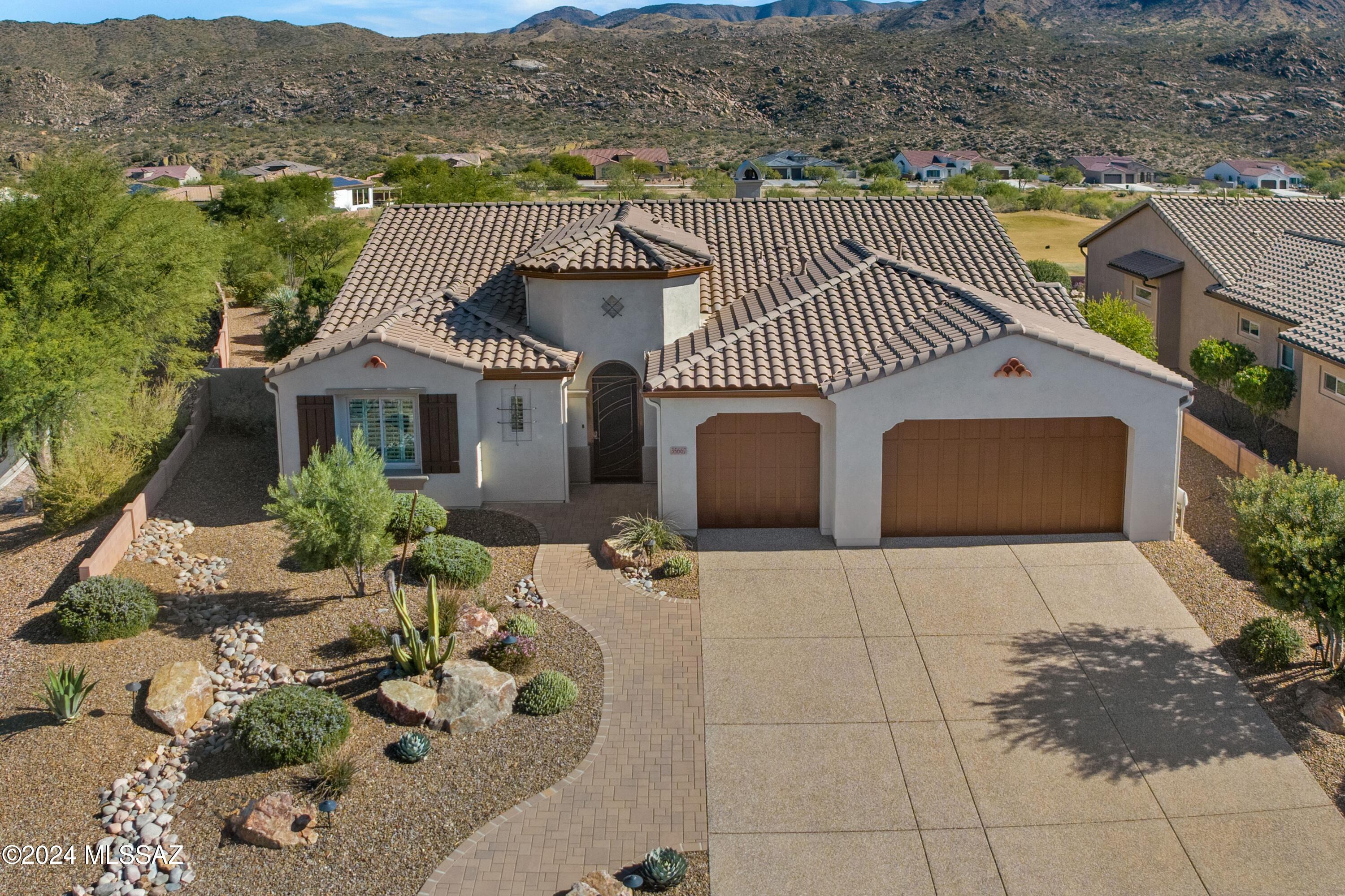 2016 Paloma located on Corner Lot with Golf Course & Mountain Views in the Preserve. Paver Pathway & Gated Entry. Great Room with Gas Fireplace & Bar Area with Wine Fridge. Open Concept Living. Kitchen has Stainless Steel Appliances, Induction Cooktop, Granite Counters, Cafe Matte Cabinets with pull outs, Large Island, Butler Pantry & Walk-in Pantry. Dining Area with Slider to Patio. Serene Owner's Suite has Ensuite Bathroom with Quartz Counters, Walk-in Shower & 2 Walk-in Closets. Powder Room & Extended Den/Office. Guest Bedroom offers Walk-in Closet & Ensuite Bathroom with Walk-in Shower. Laundry Room has W/D, Sink & Cabinets. Extended 3 Car Garage. House exterior painted 7/2024. Covered Paver Patio with Electric Rolling Shade & extended Patio to enjoy stunning views everyday!