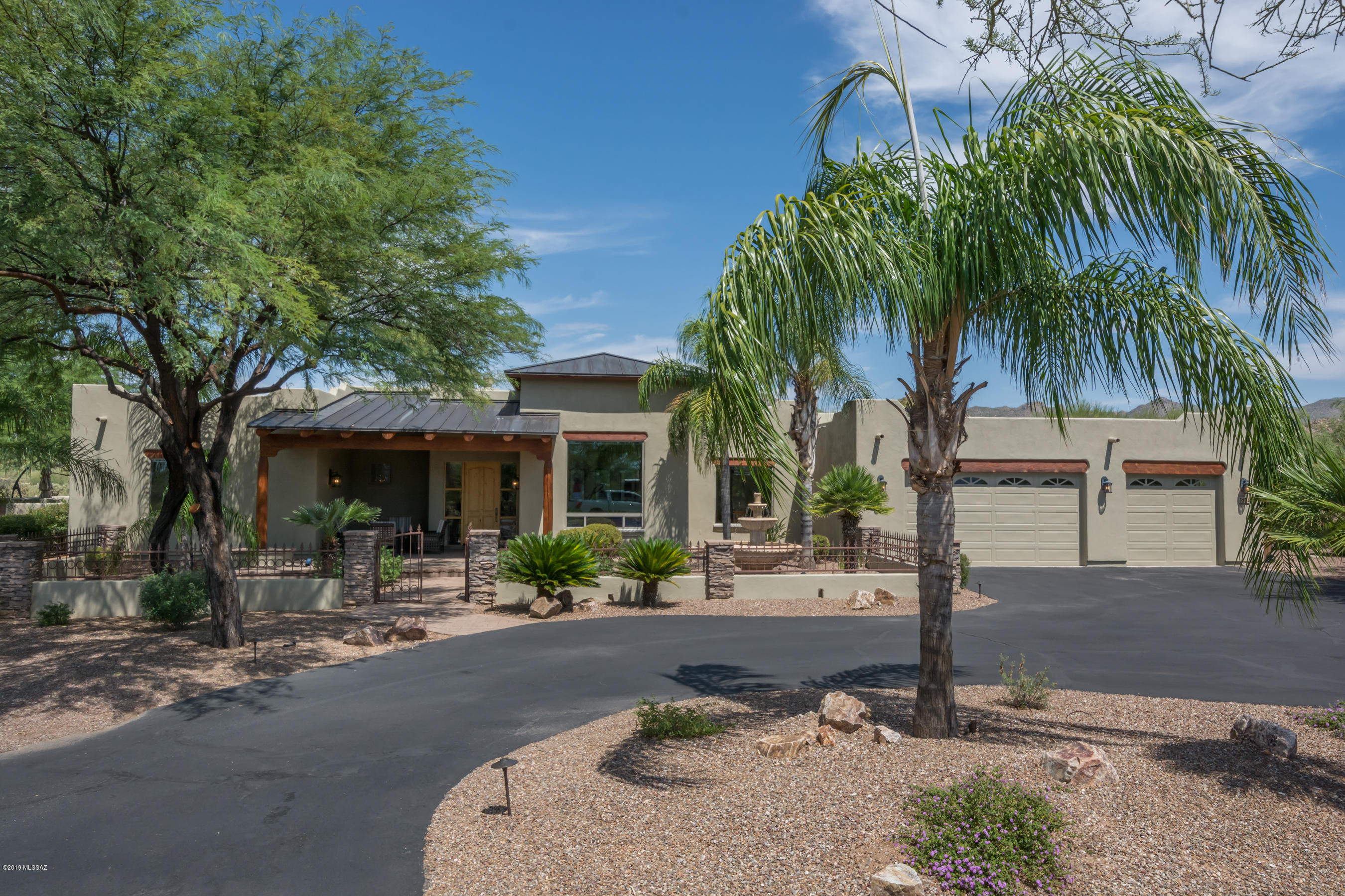 Beautiful custom 4BR, 3BA home on a private 4.58 acre lot in a small gated, paved community. The home has been beautifully appointed throughout to make your life comfortable while looking at the gorgeous views of the Tortolita Mountains and the beautiful desert surrounds. The home finishes include custom slate tile floors, granite counter tops, stainless steel appliances, designer lighting and fans, built in BBQ area, pool and spa with water feature, custom landscape/hardscape in the front and back of the home, built in fire pit and large porch for social gatherings.
You can bring your most discerning buyer to this home and it will not disappoint.