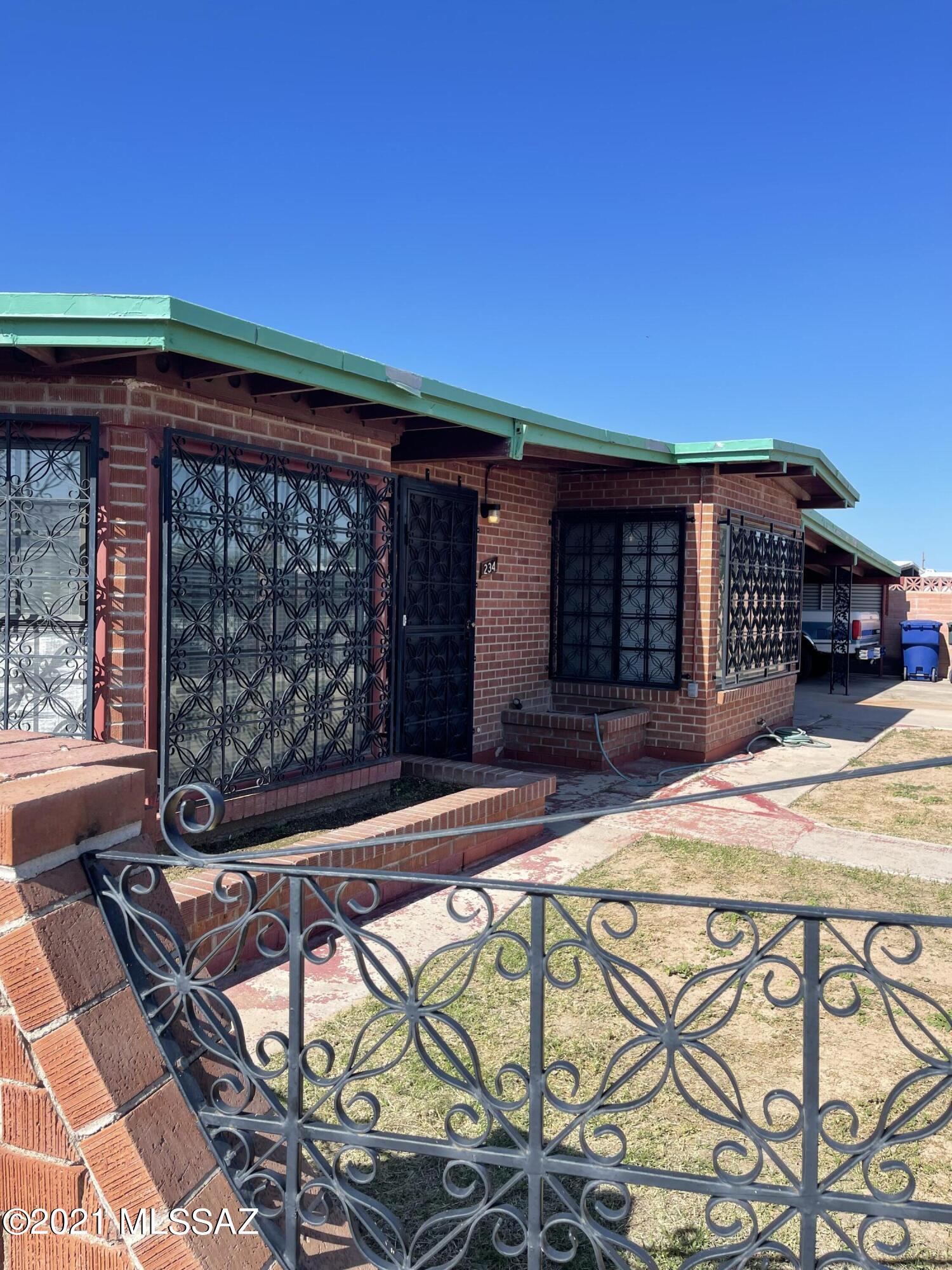 The perfect corner lot with RV/boat parking and a workshop. This rare property won't last long! Unique brick storage shed with wrought iron gate. Two Blocks from Desert Diamond Casino. This property is close to the Airport, Shopping centers and Restaurant's. Huge bonus large double gate straight into a boat or RV covered carport.