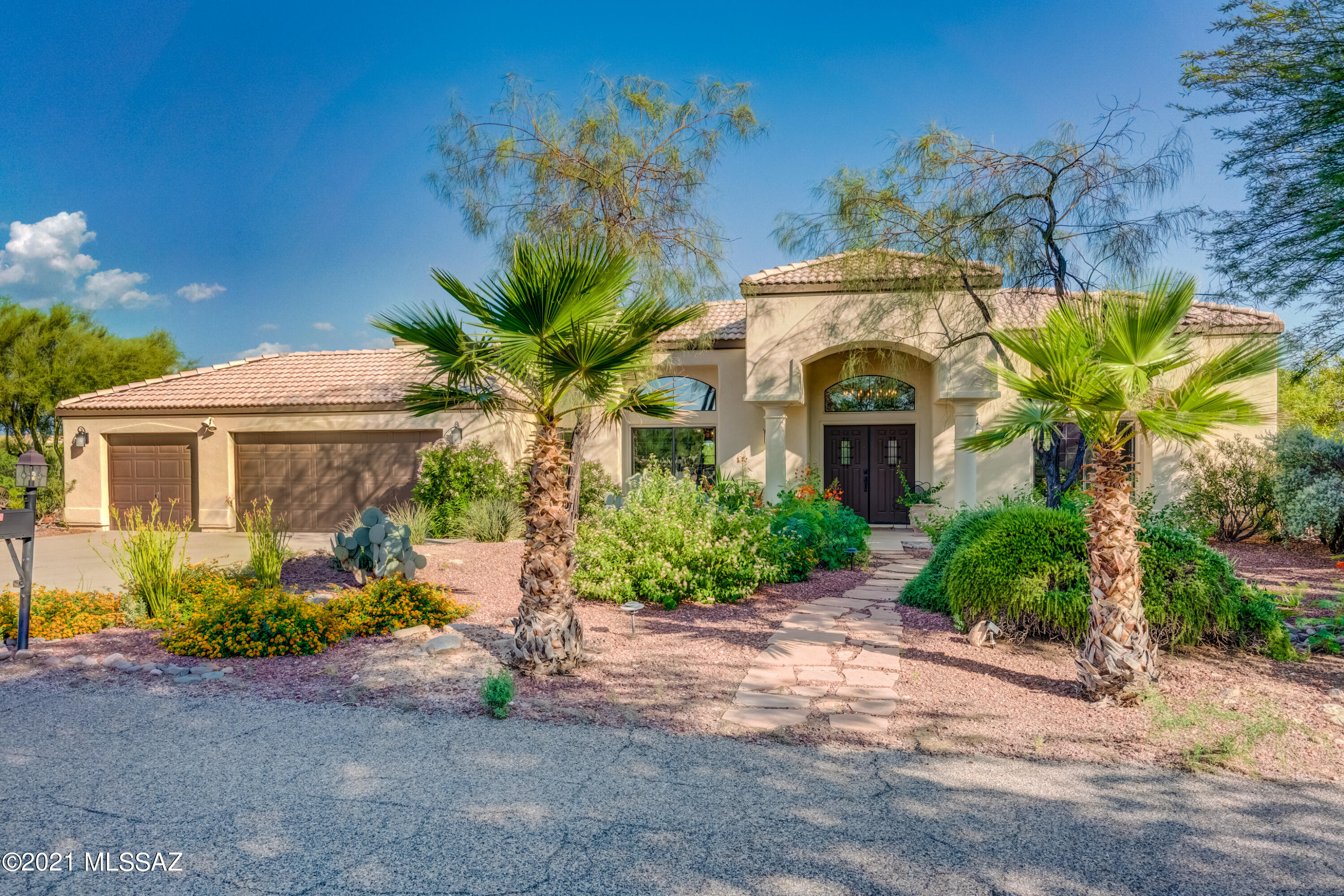 One of a kind Foothills home with spectacular mountain & city views - one of the most private lots in sought-after Shadow Hills. Full of custom finishes, the grand entryway welcomes you to high ceilings, rough sawn wood beams, artisan wrought iron chandeliers, solid Alderwood doors & rustic Mexican Saltillo tile. Lush desertscape frames the backyard oasis w/ sparking pool & spa. Prime for entertaining with expansive patio & multiple seating areas to soak up the scenery. Stunning kitchen: Viking 4burner gas range, Viking oven, butcher block island & hand carved wooden details.  Master suite offers split dual vanities, soaker tub w/hand-shower & dual entry walk-in shower. Prime location close to trails, golf, shopping & top restaurants. District 16 schools. Rare opportunity, must see!