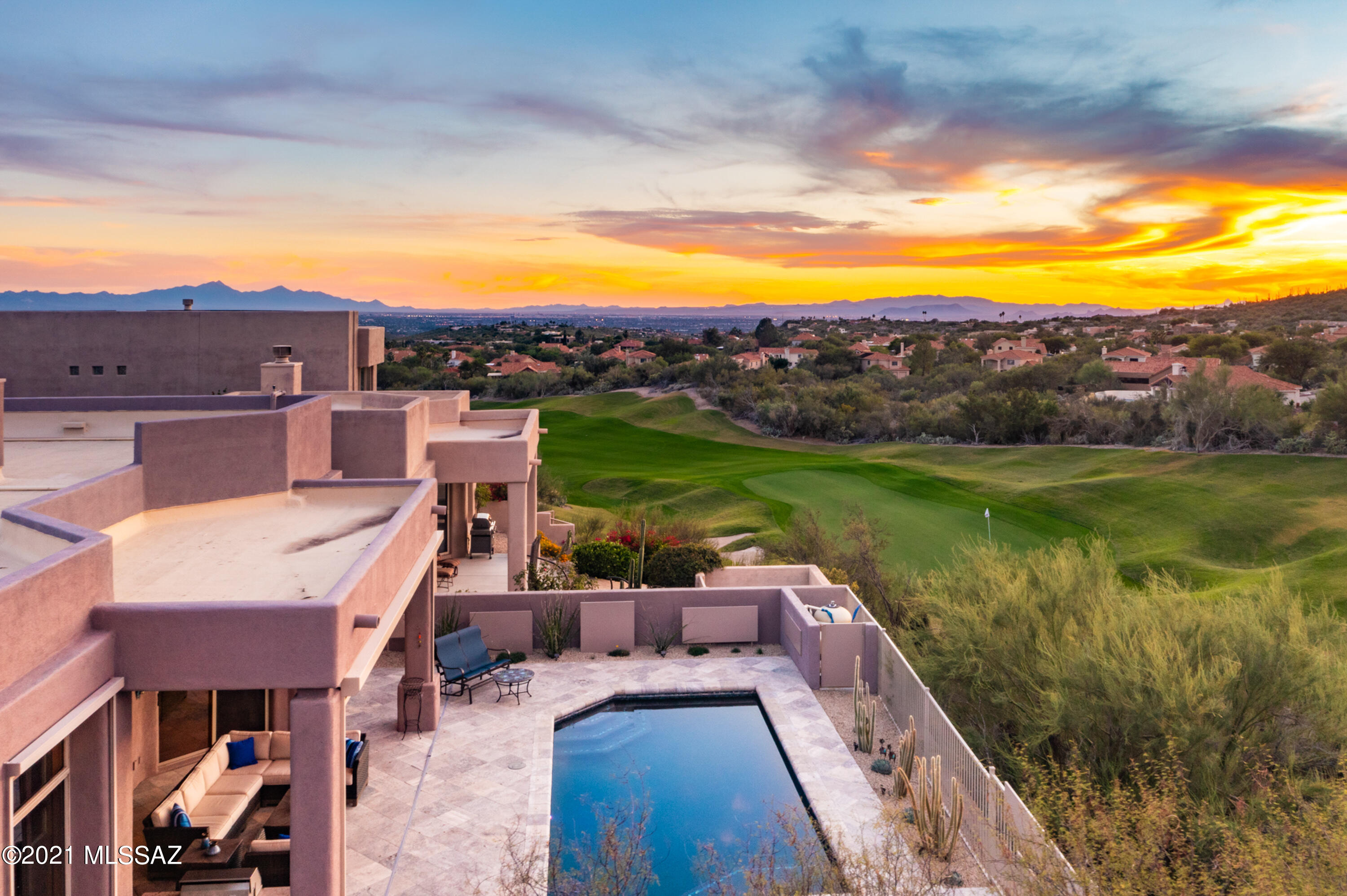 This exceptional one-level, masonry-built desert contemporary home located on a premium elevated lot at the end of a cul-de-sac (no neighbor to north)delivers unparalleled privacy & panoramic city, mountain, sunset & Ventana Canyon golf course views. Located within the gate of the coveted Ridge at Ventana Canyon, this flawlessly remodeled  & efficiently designed 3 bdrm/3 bath home provides the best of  Arizona living.  Open floor plan features travertine & wood floors-kitchen w/ huge granite center island w/ breakfast bar, gorgeous cabinetry & SS appliances opens to exquisite great rm w/ granite FP. Wall of windows fills the space w/ natural light & showcases the views & the recently renovated backyard w/ deep covered patio, travertine pavers, pebbletec pool & spa & built-in BBQ CONT... Spacious formal dining area w/ stone finished wallpaper & big picture window w/ huge mountain views. Impressive master suite is pure luxury w/ wood floors, designer paint colors, huge windows to capture the incredible views, sliding glass door to covered patio, renovated bathroom w/ custom cabinetry, dual vanities, travertine counters & backsplash & large travertine shower. Beautifully finished custom closet in master. Split bedroom floor plan offers 2 additional bedrooms & full, remodeled bathrooms. Spacious laundry room w/ storage cabinets.

Generous driveway for guest parking, 2-car garage recently epoxied, has storage cabinets.  

This rare end lot provides uncommon privacy & views.

Incredible foothills location with wonderful restaurants, shopping & world-class Ventana Canyon golf resort & country club.  Minutes from Sabino Canyon recreational area for miles of hiking trails.  

2 new Lennox HVAC units installed in 2017, exterior repainted in 2017. Current owner completed a $100k + renovation of the backyard & pool in 2018.  100% move-in ready home!