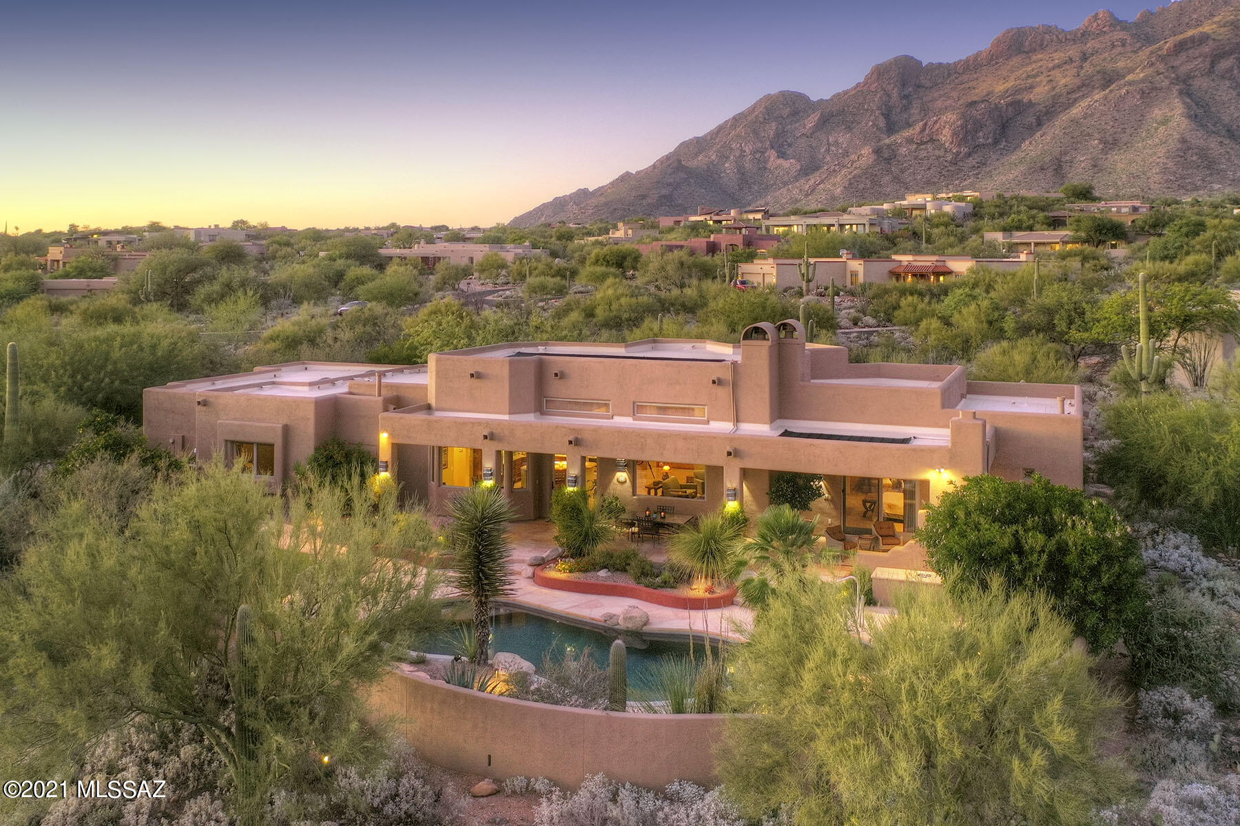 Stunning soft contemporary on a very private 1-acre homesite w/mtn views in prestigious gated Pima Canyon Estates. Front gated courtyard w/custom wrought iron gates & sparkling rock waterfall. Exceptional home with 3,377 sqft. Foyer entry w/high ceilings, exquisite Greatroom w/dramatic fireplace, walls of large picture windows, formal dining rm, gourmet island kitch w/beautiful custom cabinets, quartz countertops, stainless steel appliances, lovely brkfst area, gorgeous flagstone floors & Anderson windows, 4 bedrms (split plan) plus study/ofc, master w/sitting area, fireplace, lux bath w/incredible shower & quartz countertops, lg walk-in closet & private entry to 2 patios. Enjoy fabulous bkyard w/cov'd flagstone patio, pool, spa, fireplace, BBQ, grass, fruit trees, 3 car gar & views.