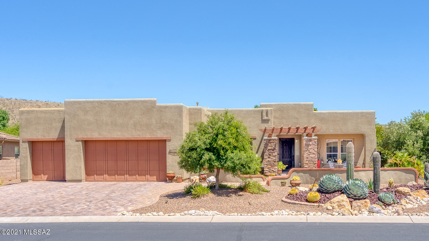 Sited on a prime North/South lot this Santa Fe style Sabino completed in 2008 is waiting for you. Welcoming courtyard w mature landscaping leads to open floorplan featuring spacious greatroom w a gas fireplace for cool SaddleBrooke evenings & wall of windows overlooking the beautiful backyard. Open kitchen features Stonite counters, plenty of cabinetry & ''black stainless'' appliances including double oven & opens to morning room. Owner's retreat has en-suite w large tile shower, soaking tub, dual vanities, walk-in closet, & direct access to laundry room. Private guest suite, full bath in hall, den/office with doors, tile except in bedrooms + 3 car garage. Outside the covered patio is extended with added ramada & hardscape. Privacy abounds with beautiful mature landscaping.