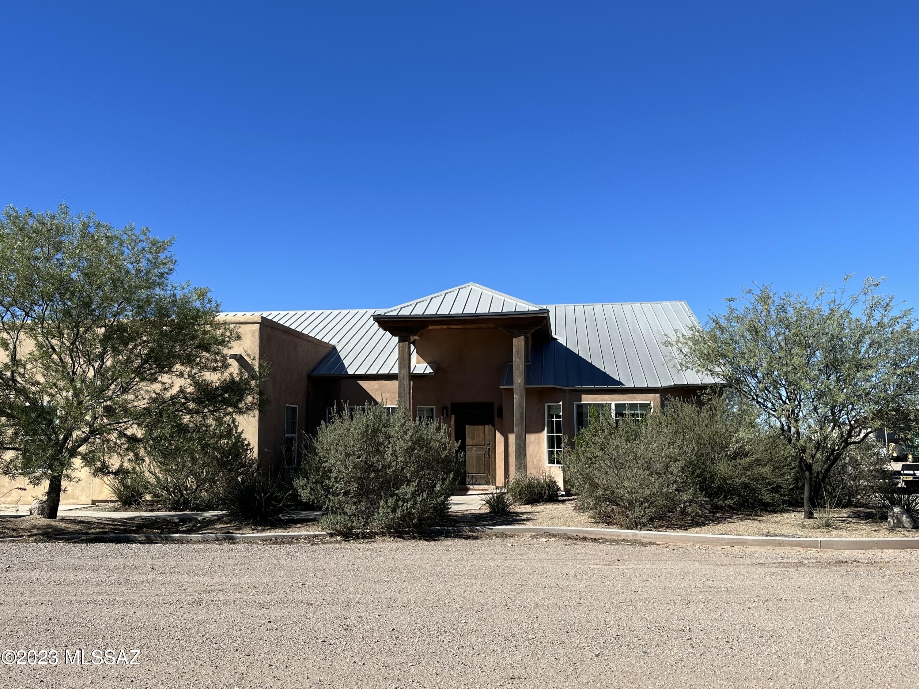 This is a turnkey home & farm including equipment. Custom built home in 2007 as the center of our irrigated farm.
We have wide open spaces with the Chiricahua mountains only 30 min away. 
2,500 sqft home & pecan orchard located @ 3600 ft. elevation in San Simon, Cochise County, AZ.  The home is 3br/2.5bath with an extra office/craft/guest room. It also includes a 30'x30' Mueller metal building with 2-20'x30' covered carports on each side. The building has an evaporative cooler, lighting and washdown duty pvc interior wall panels. The home is 2x6 construction with Mueller CF metal roof panels. Walls have an additional 3/4'' foam and 3 coat stucco finish. Interior walls are finished with American Clay Earth Plaster. The kitchen features a commercial 48'' US Range (propane) with doub oven and LG Hi-Macs countertops. All stainless sink and stainless Jenn Air dishwasher. The great room features a wood burning kiva fireplace. Also have a Water Tec R/O drinking water system installed. The home also has ceramic tile through out and engineered hardwood floors in the bedrooms & office. The bathrooms have all Kohler fixtures. Exterior & interior doors are all solid rustic pine and trim is all rough cut pine from northern NM. The landscaping is all chihuahuan desert plants on drip irrigation and the back yard features 2 covered dog kennels and buffalo grass lawn with sprinkler irrigation. There is also livestock & horse facilities including a 20'x20' hay barn and 40'x20' of covered livestock corrals. There are automatic waterers in the corrals. The farm consists of 17.01 ac of pecan trees planted in 2015 (2ac.) and 2017 (15.01ac.). Varieties are Wichita, Western & Waco planted on 20'x40' spacing and irrigated with 1/2 gpm Nelson R-7 sprinklers. 2022 harvest was 750lbs per acre in their 5th leaf. There is a 3700 acre pecan farm & processor across the road that offers custom harvest, cleaning & marketing services as an added bonus. The property has a domestic well that is 790' deep and pumps 160 gpm @ 40 psi. The static level is 318' and pumping level is 378'. The 30 hp submersible pump/motor is currently set at 480'. A new irrigation well was drilled in 2023 and pumps 600gpm. It is 1226' deep with a 620' pump setting. The water quality is excellent with TDS at 279 ppm. Sodium is only 65ppm. Filtration at the well includes Fresno sand separator & Amiad screen filter. Fertilizers and soil amendments are injected into the irrigation sets via AgriInject 50gph 3 phase pump. The domestic water system is fed off of the irrigation well and consists of 2-3,000 gal storage tanks and 3-85 gal pressure bladders and Goulds pressure pump. This area in Southeast AZ is a premier growing region for pecans with yields averaging 2500 lbs per acre for 10 year old trees. Pecans have crop revenue protection insurance with a county trigger amount @ $3200 per acre. The tractor is a 2006 John Deere 6520L, 4WD, with front mounted PBM hydraulic spray booms for weed control. Includes 225 gal. 3 point hitch tank and Hypro roller pump & TeeJet controls. Additional equipment: 14' Vrisimo low profile flail mower, 6 way Bison hydraulic blade, field cultivator. There is an additional 1/4 acre with drip irrigation for planting farmers market type vegetable crops. Property is fenced & gated.