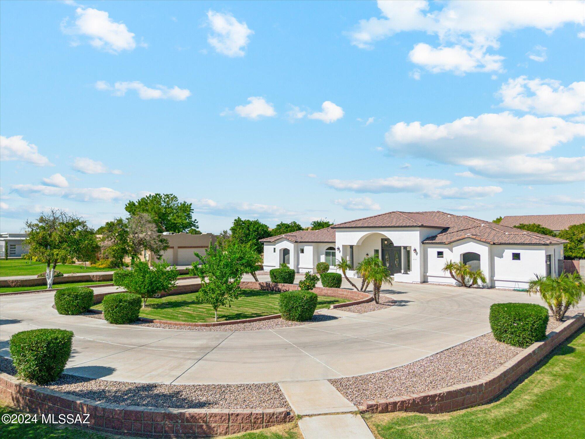 Your own ''Back Forty'' includes a traditionally classic 3600+ Sq.Ft., 5 bd., 3.5 ba., 3 car attached garage home, plus an AMAZING  3,500+ Sq.Ft., detached shop with 740+ sq.ft. apartment (casita), 3 overhead doors and interior space that are both ample size for a large RV, and a full auto collection.  3 dozen mature fruit trees.  Classy concrete circular guest arrival driveway, plus concrete and gated driveway to rear property (SHOP) and concrete exterior parking for dozens more vehicles, trailers, projects and storage.  Location is quietly hidden in plain site from the crowd, but still in the heart of the town's best conveniences.  A major challenge to find another available home with 1.5 acres and established full scale shop, let alone in this condition and location.