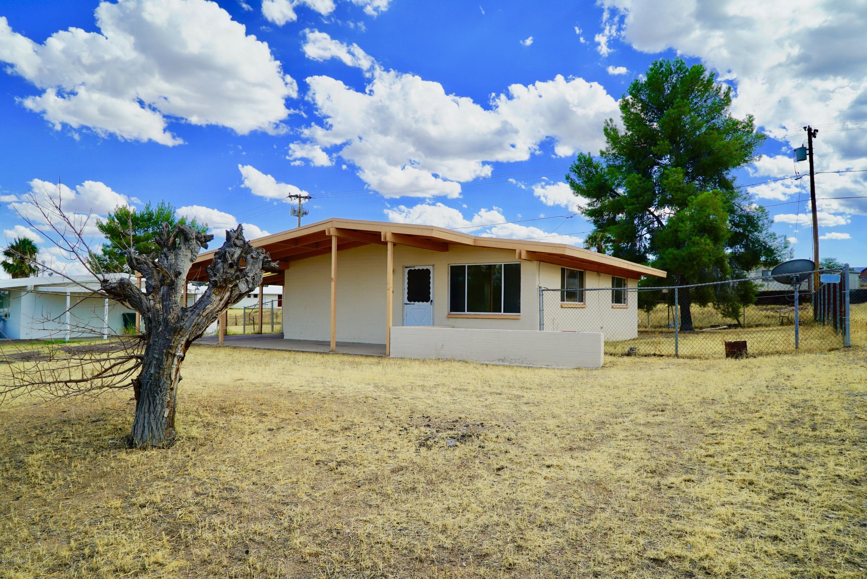 Range priced $60K to $70K. Seller will accept or counter in this range depending on buyers needs. Cute move-in ready Bungalow on a large lot ready for a new owner. 2 bedroom 1 bath w/ 1 car carport, Porch, TRANE HVAC system w/ cold AC. Tile Throughout home! New Black appliances installed included refrigerator, gas stove, microwave, & dishwasher. Washing machine hookup in kitchen & dryer hookup in storage under carport. Mountain views from front yard! Fresh paint! Huge bonus closet just needs shelving to be a huge walk in pantry! Storage shed in back yard & under carport. Double drive in gate in back. Fenced yard w/ dog run as well.  Home warranty included with full price offer! Home is also for rent for $600 per month.  SELLER WILL CARRY!