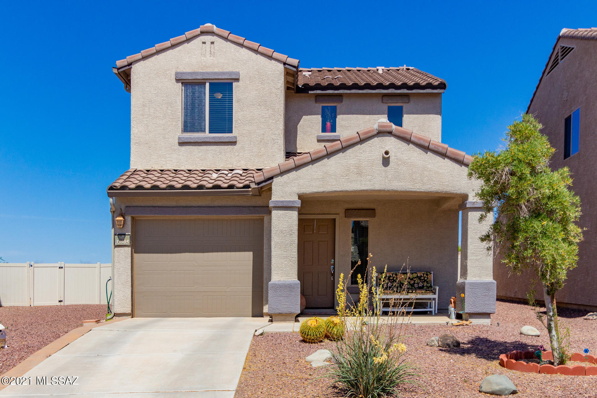 Charming two story home w/a front porch entry & desert landscape. Open floor plan, plush carpet, soothing palette, ceiling fans, & window blinds. Handsome kitchen cabinets, granite counters, recessed lighting, neutral tile floors, pantry, & patio access from the dining area. Plush carpet in all bedrooms, ample closets, & an interior laundry room. Private master en suite w/dual sinks. Enjoy the backyard covered paver patio w/an extended patio for dining. Room for a pool! Take a tour today & stop renting!