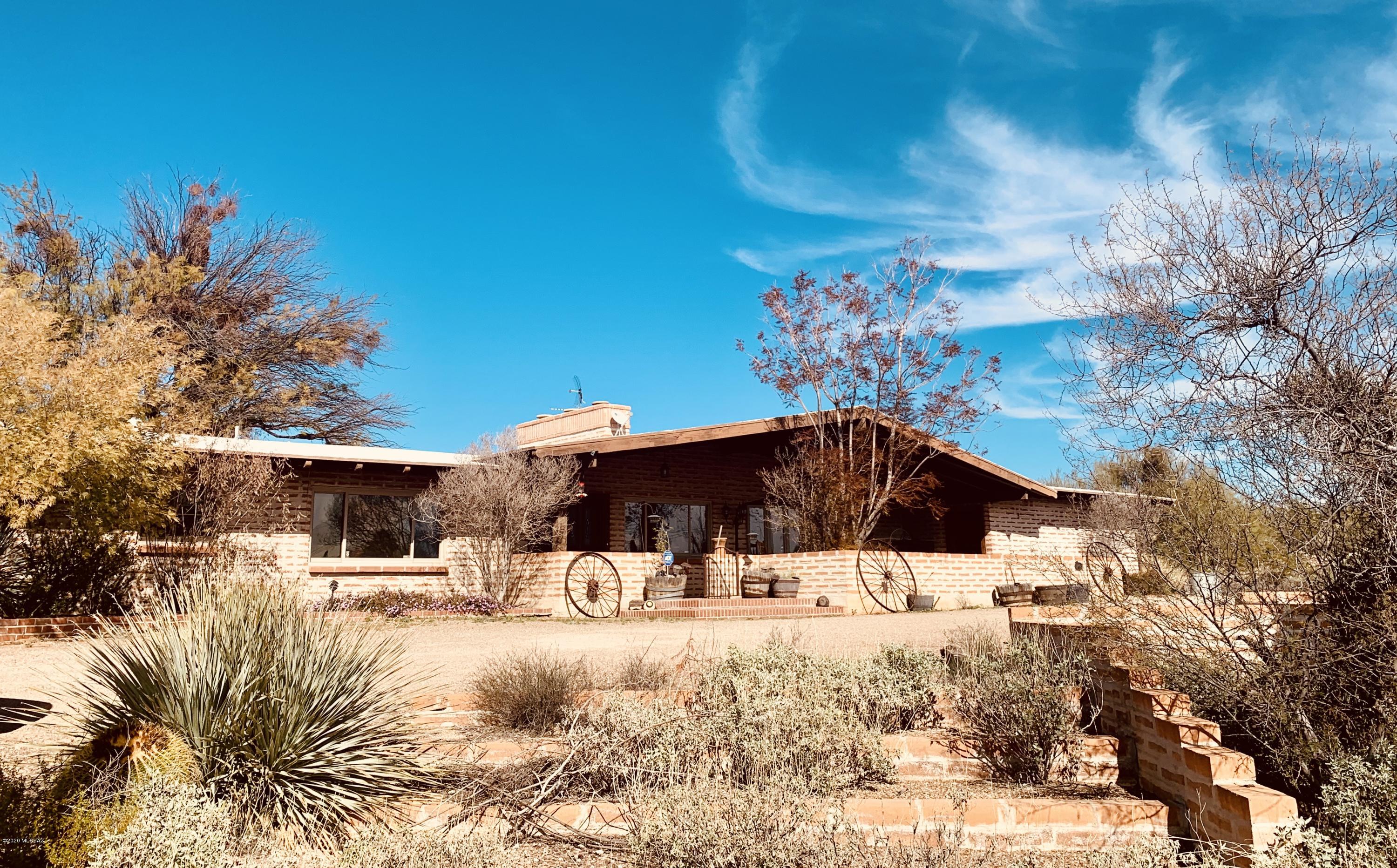 Seller will entertain, counter or accept offerers between $500,000 - $525,000.  Experience nature and  amazing mountain views in this stunning 4 bedroom 2.5 bathroom Farm House Ranch style home located on 3.26 acres. Oversized windows, soaring wood beam ceilings, hard wood floors, paved courtyard with waterfall pool and horse facilities.  Loaded with character, a must see!