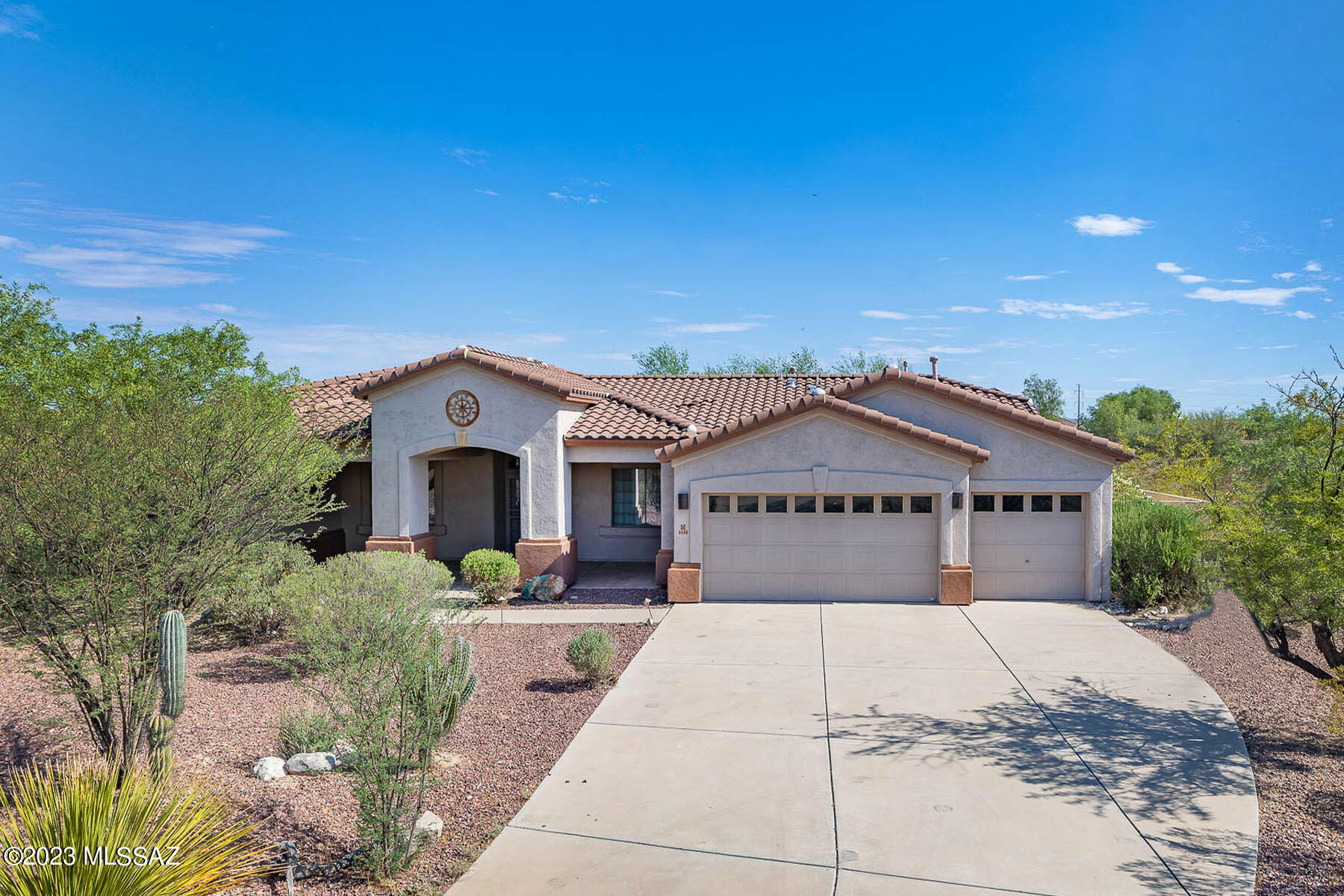 Situated in a highly desirable neighborhood with lovely Catalina Mountain views this home is what you have been looking for. Great floor plan with office and sitting room. Sited on a private 2.1 acre lot with a fully fenced backyard and amazing views to enjoy the Tucson lifestyle. 3 year old roof too. Great room concept with high ceilings and gas fireplace. Primary retreat features a generous-sized closet and bath with see-through fireplace and a separate shower and bathtub. Granite countertops in chef's kitchen with island and pantry. Three car garage gives you room for all your toys. Easy access to I-10 and just minutes to all Tucson has to offer. Great neighborhood and location!