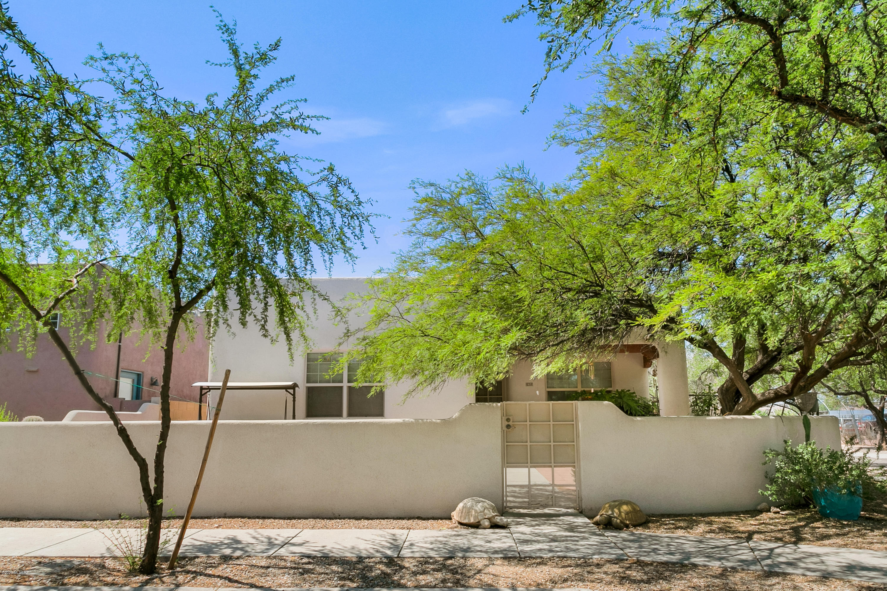 Finally, the home you have dreamed of is here.  This 3 bedroom, 2 bathroom, full custom Civano home has now become available for you. From top to bottom and from inside and out.  Your new home is not only located in one of the best neighborhoods in Tucson Arizona, your new oasis has everything that would make living here home.  New custom courtyard and home has been recently finished in energy efficient cork . The HVAC system is a Trane and was  installed 4 months ago, along with a water heater and windows.  This is just the start of all of the upgrades done, and did I mention everything is under warranty.  Crime Guard AZ room and window screens, will keep you safe in this spectacular specimen of near perfection.  Move in and Live the Civano Way. PS. Sealed and treated by Truly Nolen.