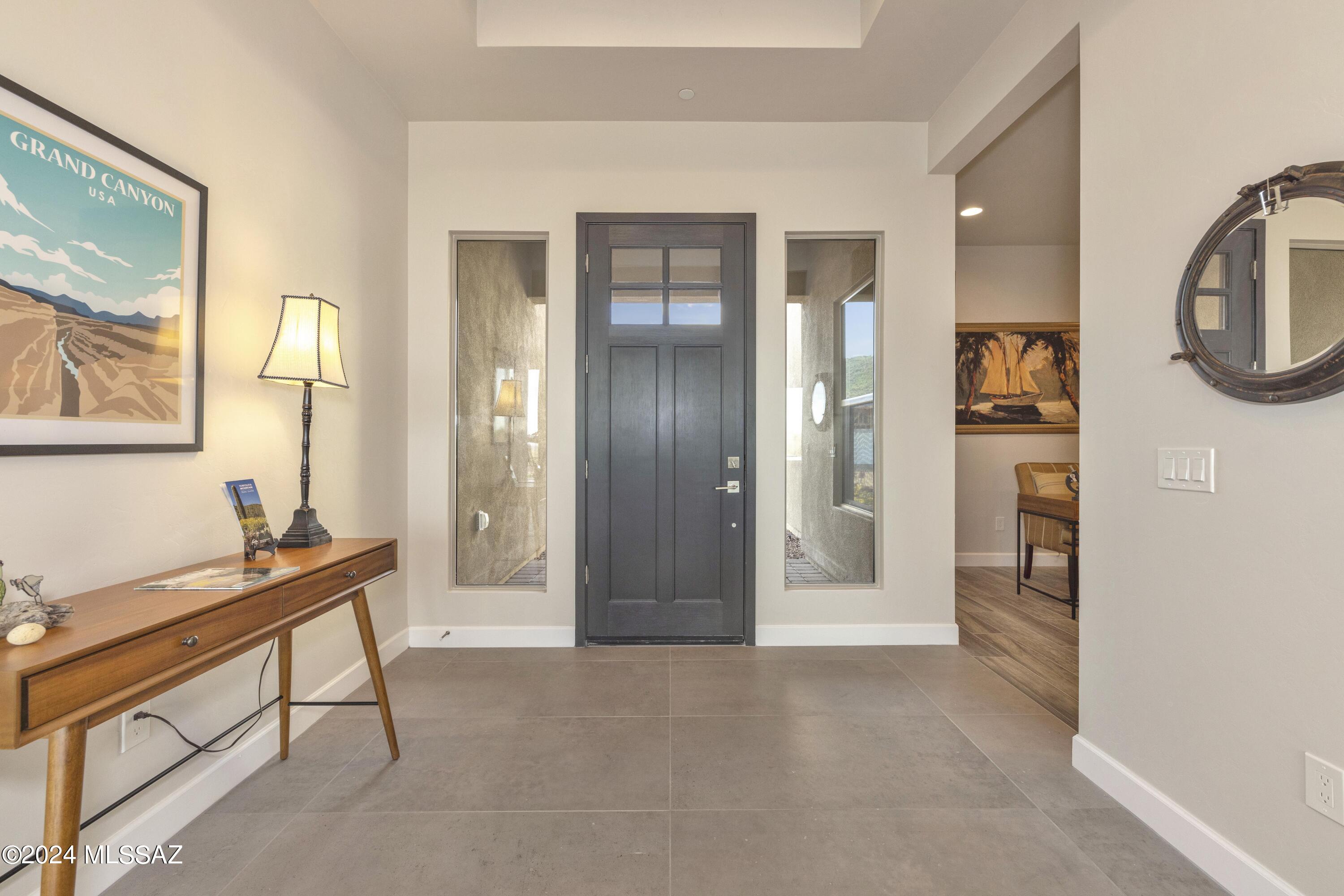 Don't miss out on this spacious Mesquite home nestled at the base of the Tortolita mountains on a cul-de-sac lot! This Mesquite features 3 en suite bedrooms, an office, a Butler's pantry, 12' ceilings, and a sleek 16'X10' multi-slide at Great Room out to your expansive private patio. You'll have plenty of space for all your toys in the 3-car garage which also includes an epoxy floor! Renderings are conceptional  and may not depict the exact final product. Contact our sales office to schedule an appointment!