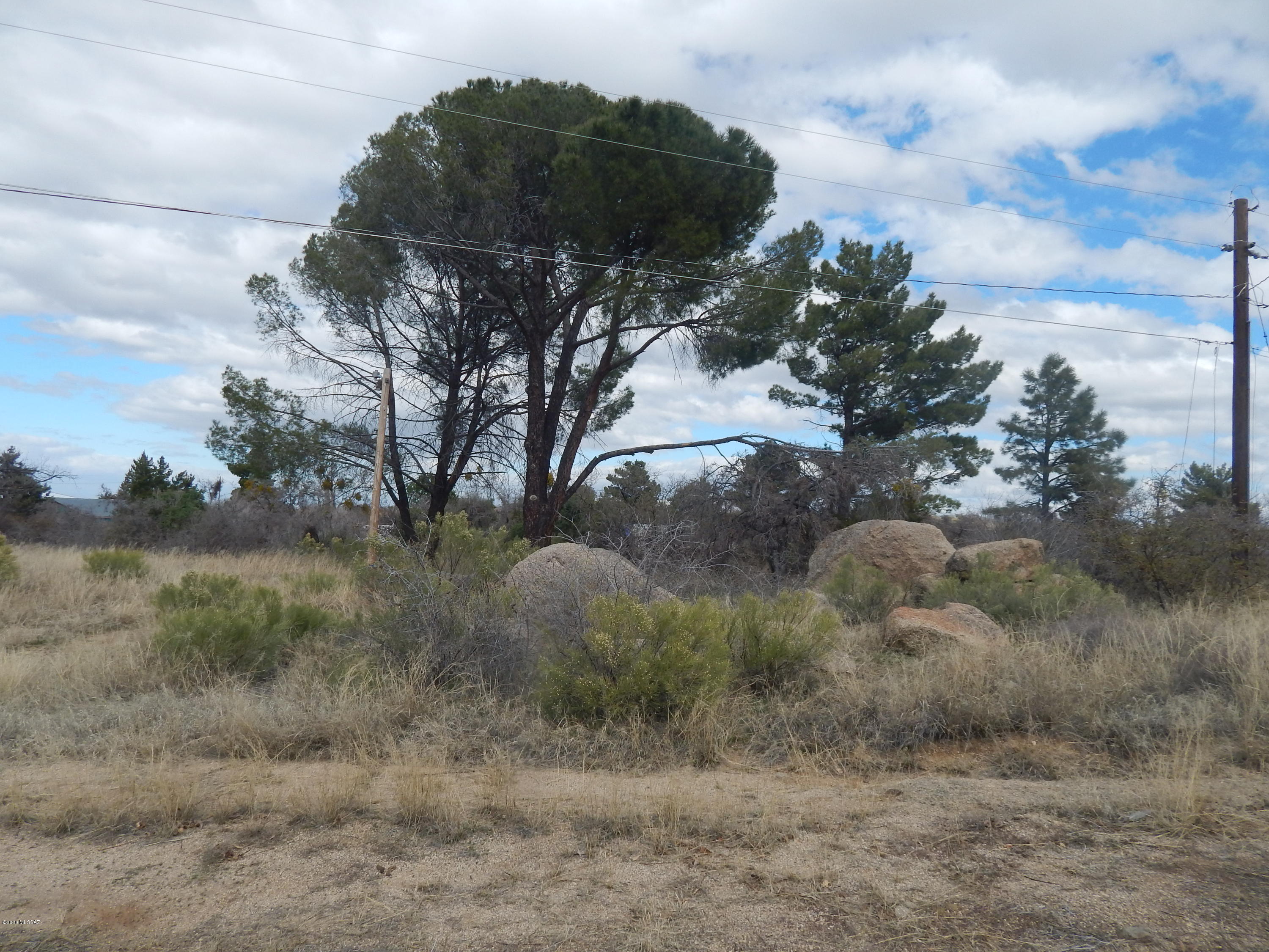 Very hard to find lot with water and electric on the property. Nice buildable lot with boulders and trees.  The property had an older manufactured home that has been removed.