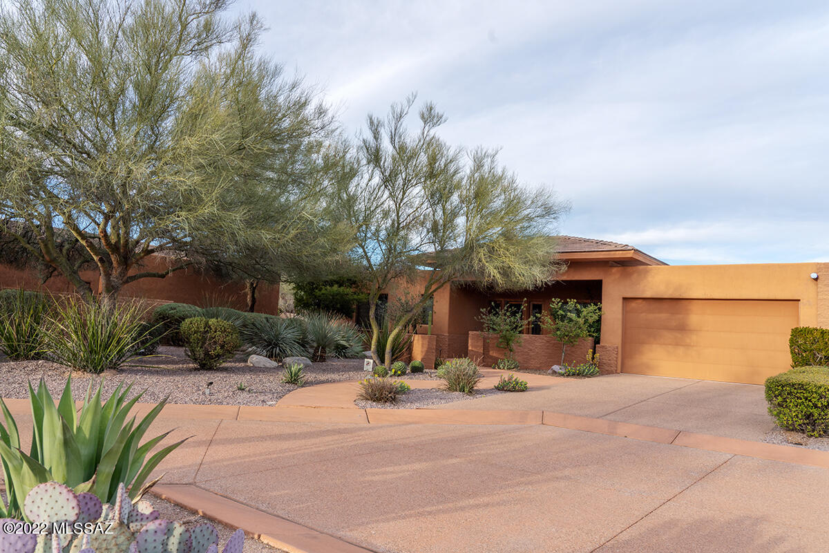 Don't wait to see this well priced beauty located in the world renowned Canyon Ranch Resort & Spa.  Live your best life with access to a variety of fitness classes, lectures, guided hiking biking excursions, perfect your tennis or pickle ball game--whatever inspires you Canyon Ranch can accomodate...so much to explore with the expert advice of the Canyon Ranch team. This home is like new, barely lived in, soft contemporary, peaceful & quiet, enjoy sunrise in the back and sunset in the front.  Allow the serenity of the Sonoran Desert to lull you into rest and recovery, in contrast with the opportunity to live your most exciting and inspired life at Canyon Ranch.  Safety & security are paramount here, 24 hour roving security, manned front gate, you'll be well taken care of here at the Ranch!