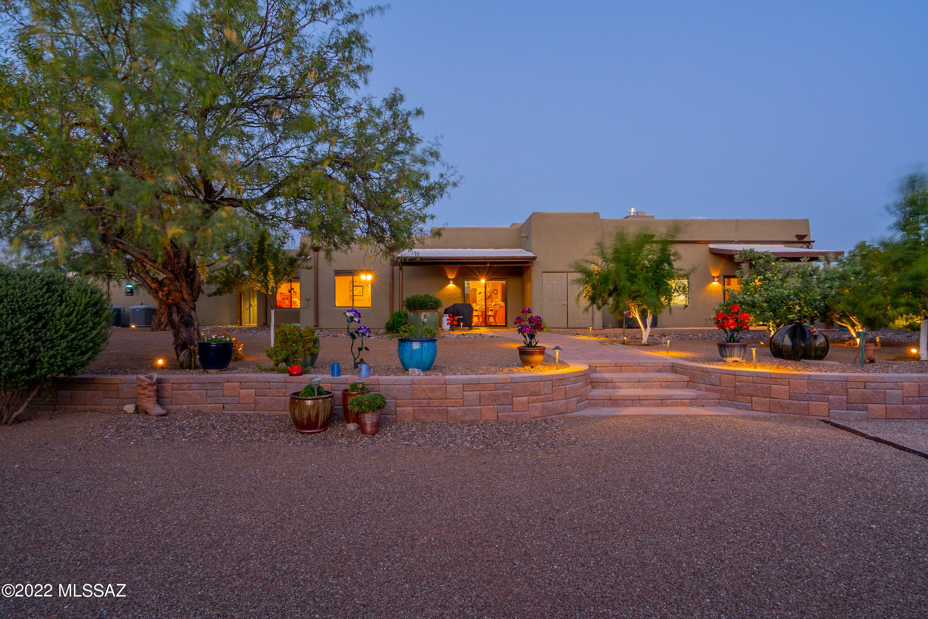 Majestic 5.45-acre desert estate. Amazing mountain views throughout. Warm and cozy lodge style wood beamed great room with beautiful fireplace. This home is an entertainer's dream with a gorgeous kitchen and generous breakfast bar. Featuring 4 bedrooms w/3 bathrooms. Meticulously manicured park like landscaping with 10 types of fruit trees. Stunning sunrise and sunset views. Oversized 3 car heated and cooled garage allows for multiple uses. Abundance of wildlife including deer, javelina, and quail in your front yard.2 RV Hookups in place.5000-gallon water storage tank. New well drilled & well agreement in place. Property has been surveyed.3 phase electricity is available. Could have a machine shop. This home does not have an HOA & there is plenty of room for horses,toys & all your hobbies.