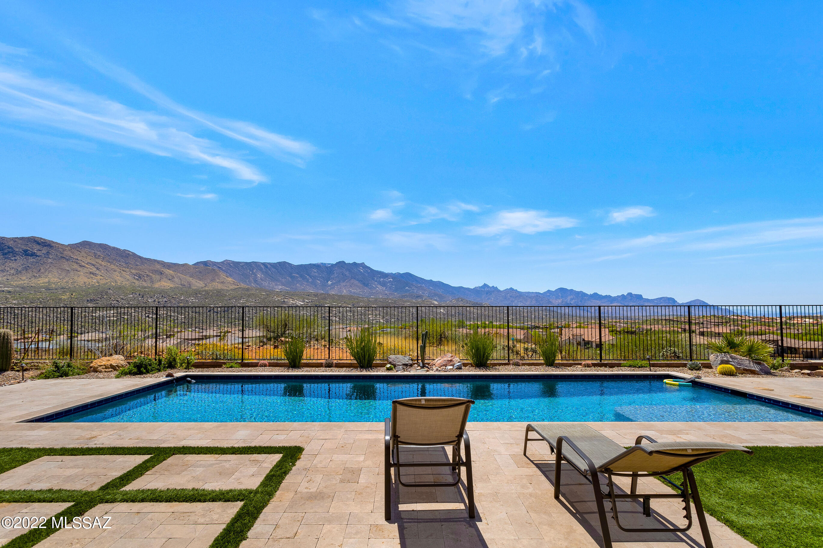 Upgraded 2018 Bell Tower Model with Guest House located in Sundance Ridge with Pool, Panoramic Mountain Views & 1.27 Acre Lot. This 4 Bedroom + Den + Bonus Room / 4.5 Bathroom / 3,749 SF / Extended 3 Car Garage home is a rare find! Plank tile floors thru main areas of home. Great room has walls of windows. Kitchen has Stainless Steel Appliances, 2 Ovens, Gas Cooktop, Granite countertops, Large island & walk-in pantry. Dining Area with large slider to patio. Owner's Suite with upgraded Bathroom & walk-in closet. Den with French doors. Powder room. Bonus room with door to yard. 2 Guest Bedrooms with en-suite Bathrooms. Guest House with living room, bedroom & bathroom. Covered Patio with Gas Fireplace & travertine pavers. Salt Water & Solar Heated Pool. Lovely Landscaping & Gated Yard. Gated Community. SaddleBrooke's Preserve Golf Course & Restaurants are near by for your enjoyment!