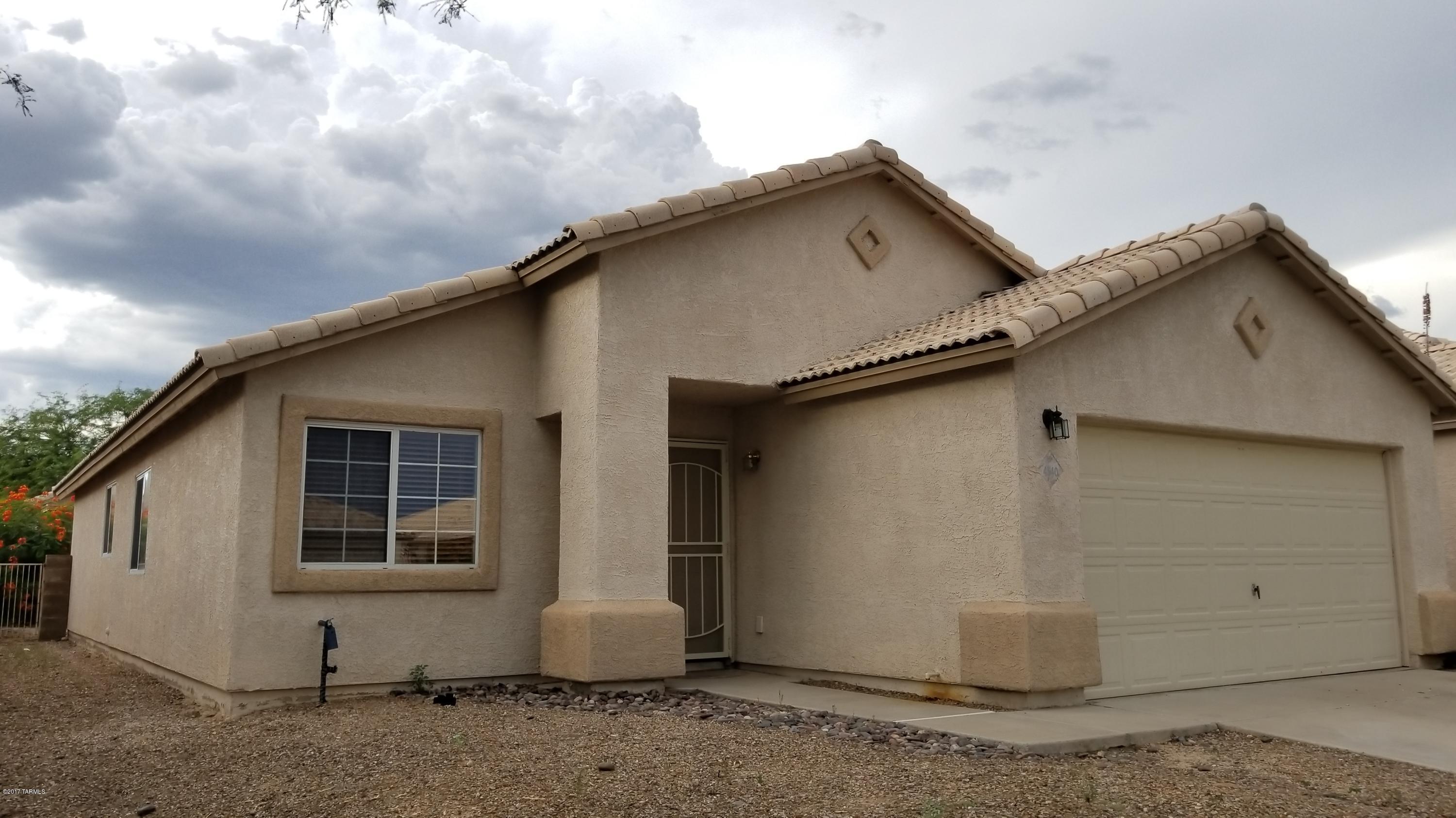 Bright and roomy 3 BD/2BA home with tall vaulted ceilings in northwest Tucson tucked into a lovely small neighborhood and ready for move in! Entry opens up to the spacious living room and formal dining. Kitchen features plenty of storage with a center island and breakfast bar overlooking the dining area. Master suite has a private bathroom and huge walk-in closet. Home also has 2 guest bedrooms, guest bathroom with shower/tub, large laundry room, and 2 car garage. Backyard is beautifully hardscaped for minimal maintenance and all rear wall for privacy.