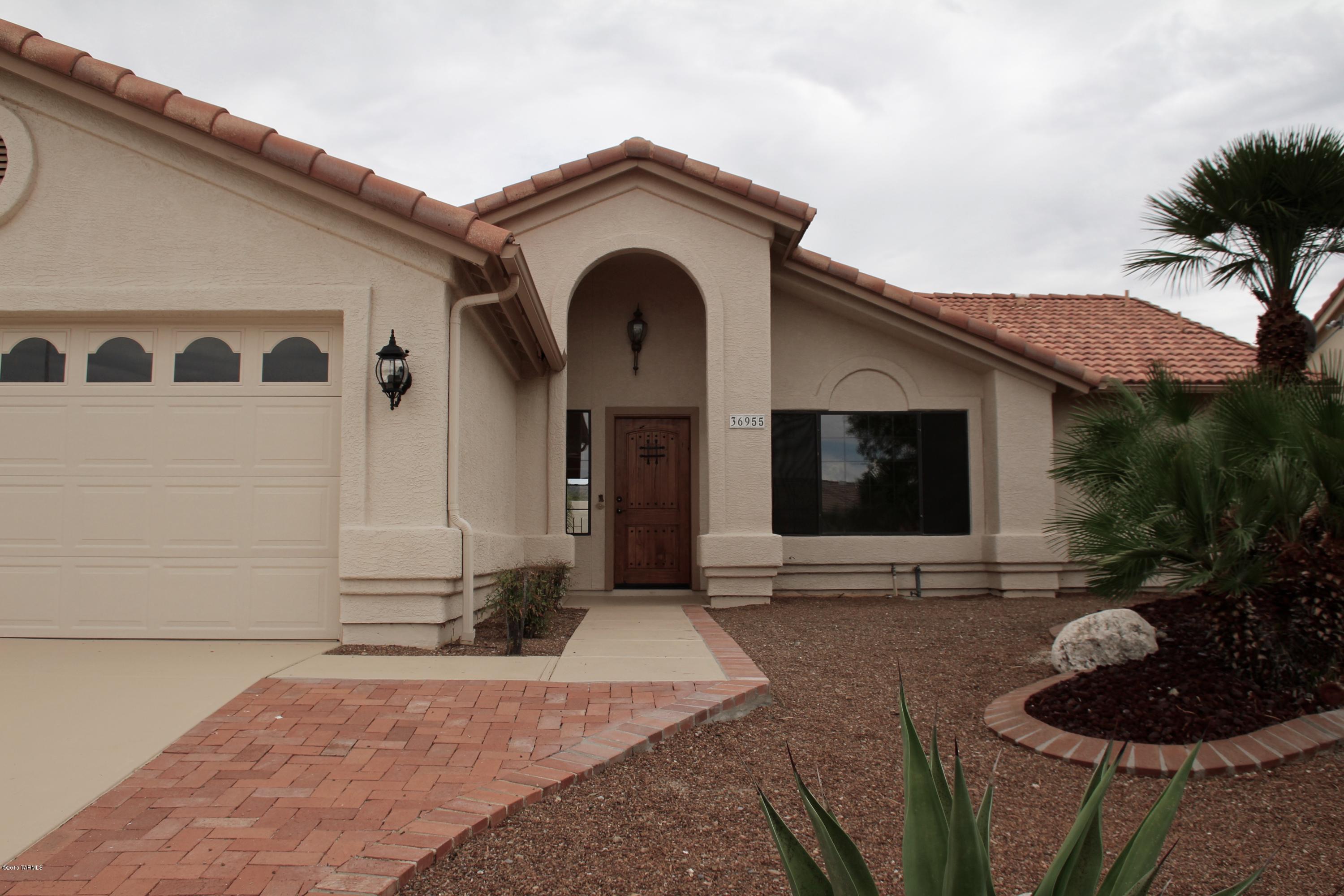 Beautiful Move in Ready Home, just Throughly Updated & Upgraded and ready for you! Fabulous lot with Breathtaking Views in all directions! Resort style backyard, you can swim year round in your Heated Private Pool. Amazing Kitchen features all New Granite,New Appliances and Refinished Cabinetry, Entire home features New Tile, (No carpet in home) All New Interior 2-Tone Paint, New Glass Shower enclosures. Large Master Suite with Views, New tiled shower, Dual Vanities, Walk-In closet. Beautiful private, senic backyard. Fabulous Adult Golf/Tennis Neighborhood, located in the Beautiful Santa Catalina Mountains.