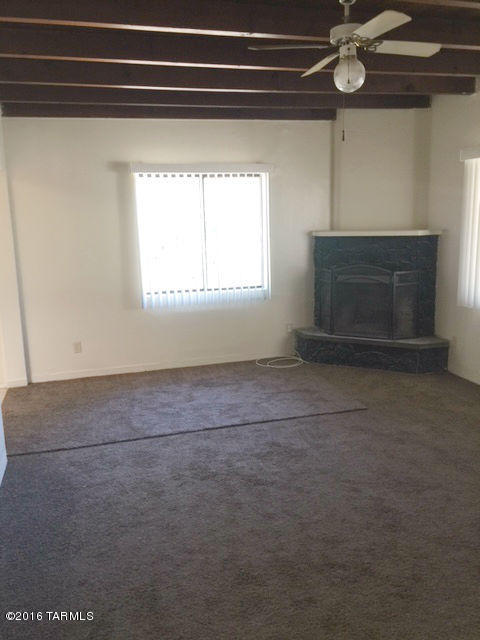 Spacious 3 bedroom, 2 bathroom house located in central Tucson. New paint, and new carpet throughout. Large backyard. Close to shopping, transportation, & restaurants.