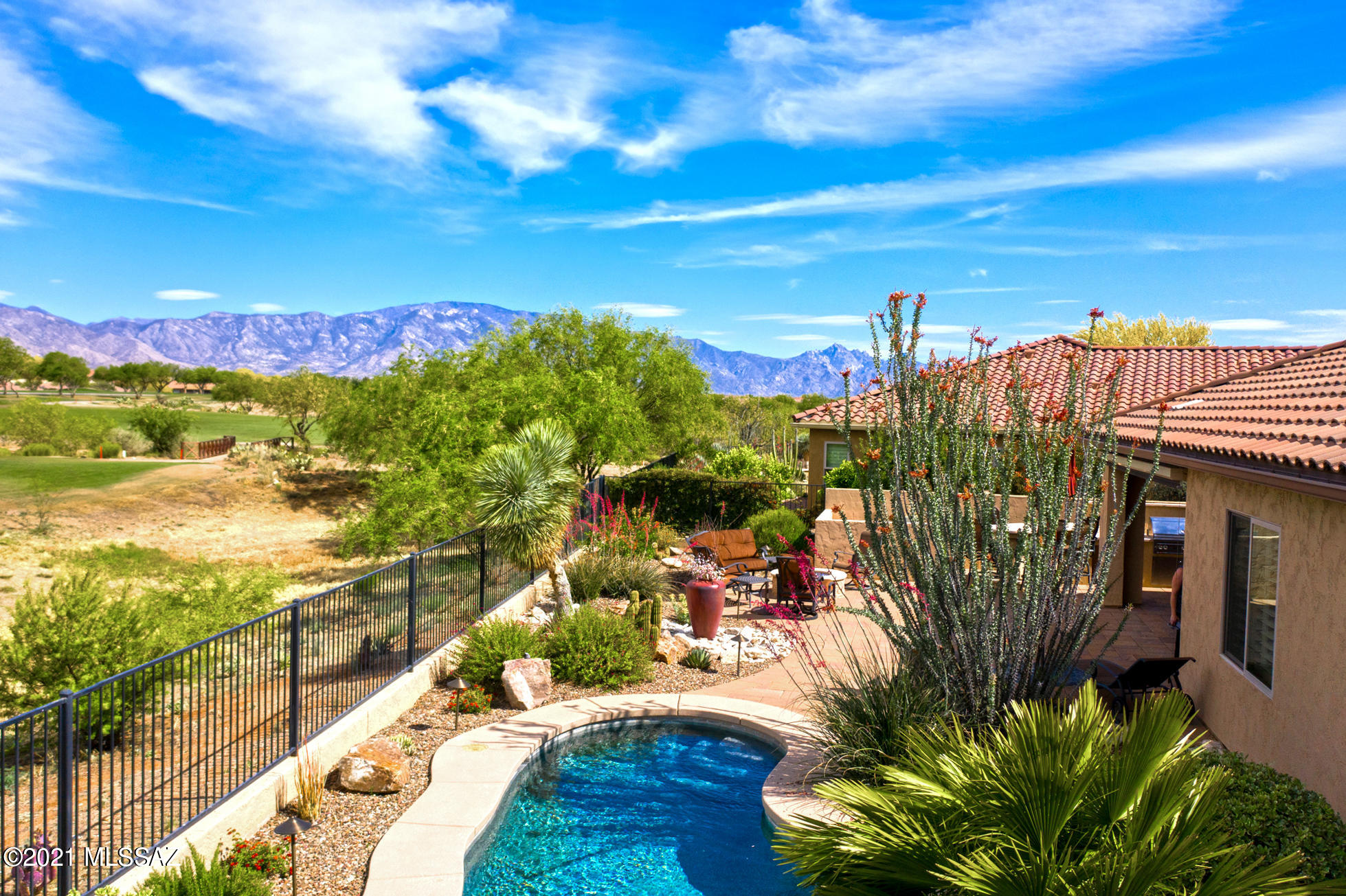 We're Proud to Present 2012 Highly Upgraded Verano & Guest House, Saltwater Spool, Golf Course & Mountain Views, 3 Bedrooms, Den, 3.5 Baths, Ext. 2.5 Car Garage, 2,938 SF home. Pavers in  driveway, pathways, courtyard with gas fireplace. Great Room with stacked stone gas fireplace. Outstanding Kitchen with granite counters, stainless appliances, custom cabinetry, & large island. Dining Room with built in wine bar & refrigerator. Owner's Suite with updated bathroom & custom designed closet. Den/Office has French doors & built in bookcase. Guest Bedroom with en-suite bath. Laundry room with storage & utility sink. Covered patio with electric rolling shade. Gated private yard, built-in BBQ, saltwater spool, cozy gas firepit, golf course & mountain views to enjoy. All amenities are nearby.