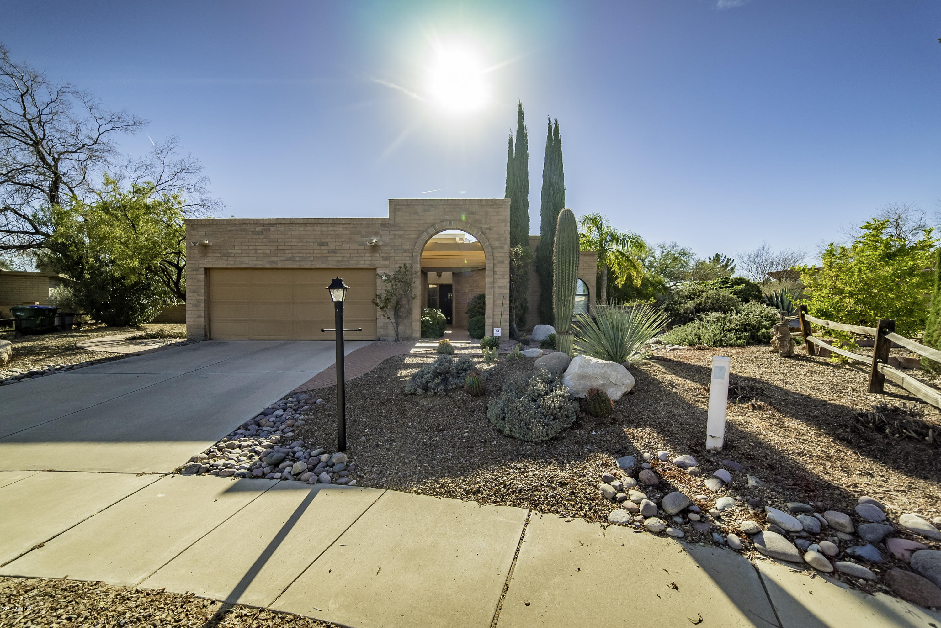 One look and you'll want to make this free standing home in a cul-de-sac yours. The outstanding curb appeal makes a great first impression and it keeps getting better as you move through the space. Large windows bring the light streaming in and the owner's use of color mixes beautifully with all of the strong art pieces. It has an easy living floor plan with both bathrooms updated, tile floors throughout, as well as gorgeous windows coverings & designer ceiling fans. It is being sold fully furnished except for the art pieces, many of which are available SBOS. There is a wrap around covered patio in back, easy care lush landscaping and a breathtaking mountain vista.