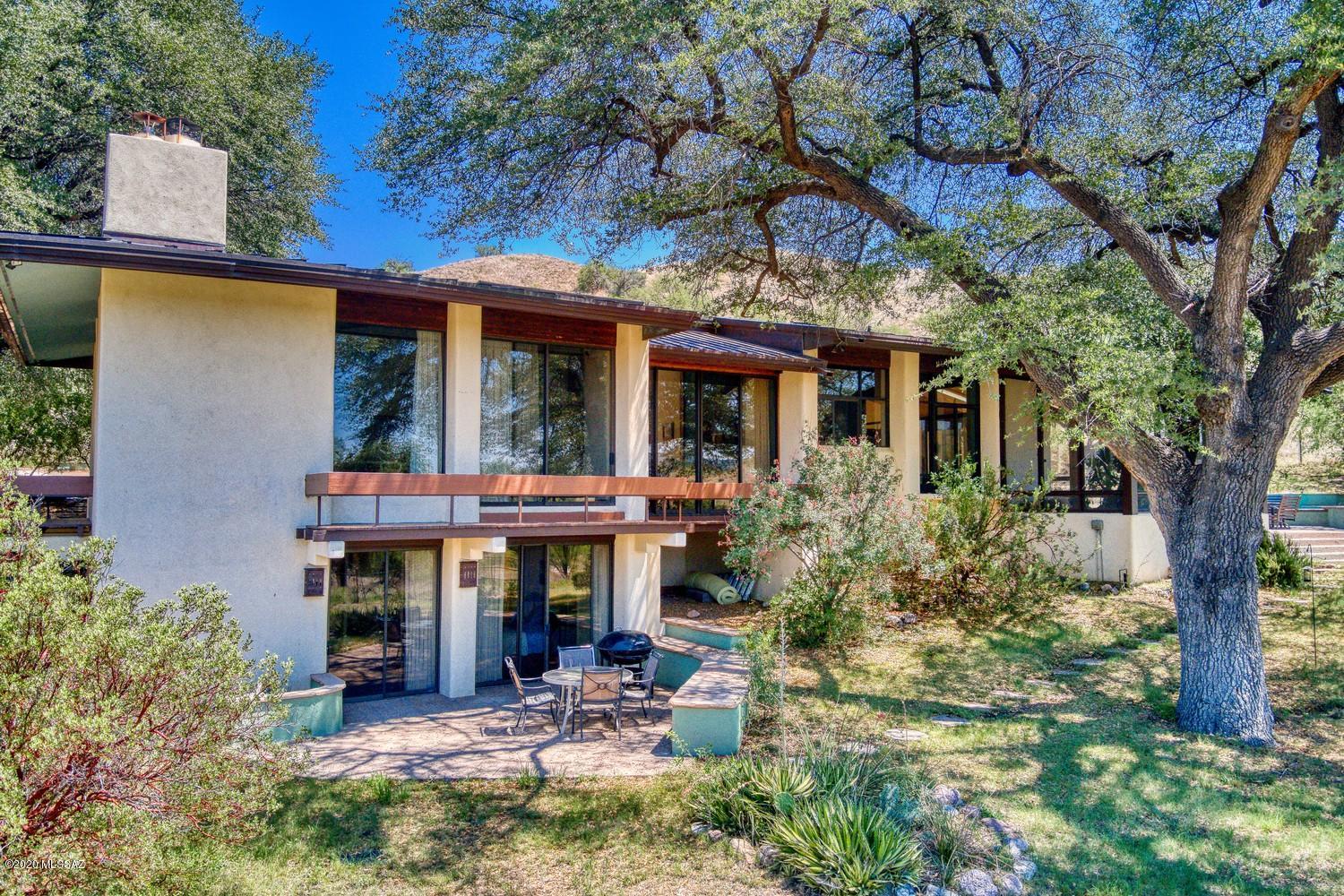 Exquisite Gordon Luepke Spanish Colonial estate nestled on 40 pristine acres of oaks and rolling hills in prestigious CROWN C RANCH. Stone gates, tree
lined drive and unparalleled views greet you. Grand foyer dazzles with it's soaring skylight ceiling. Showstopping formal dining room opens out to a romantic
balcony overlooking your private valley . Even the most discerning home chef will delight in this well-appointed kitchen to include dual ovens, over-sized gas
cooktop, expansive Corian counters, oodles of cabinets and huge walk-in pantry. Separate and spacious living areas provide unique spaces for living and
entertaining. Home is crossed listed in VRBO for buyers who would like to spend additional time experiencing home. See ''SUPPLIMENT'' for important
information Peaceful Arizona room opens out to sparkling pool and patio for year around outdoor living. Master suite beyond perfection with cozy fireplace and Yoder HE insert. The most luxurious en suite master bath features dual vanity counters, soaking tub, walk-in shower, 2 dressing and closet areas with built in cabinetry. Split floor plan features a lovely private room on upper level with built in bookshelves. Perfect for den, study or additional guest bedroom. Lower level is the perfect retreat for guests or additional living and sleeping areas. Cozy great room with wood burning fireplace and wet bar. Master bedroom with en suite bath, generously sized guest bedroom and convenient hall bath. Grand wine cellar and 2 large storage closets on lower level. Both master bedroom and great room open out to backyard for views, outdoor living and level entry into lower level. Additional detached 2+ car garage with room for workshop area. Expansive grounds feature a garden with raised beds, composter and irrigation and is completely fenced with block wall and a serene wildlife pond. Breathtaking views and gracious country living.

IMPORTANT AVAIAN HABITAT ACCORDING TO AUDUBON
WITH MORE THAN 300 BIRD SPECIES INCLUDING RARE AND UNIQUE. Perfect home for birding!
Gray hawks
Vermillion flycatchers
Thick-billed kingbirds
Black-bellied whistling duck
Black-chinned hummingbird
Lesser goldfinch
Oriole
Black Phoebe
Yellow warbler
Yellow cuckoo
Great blue heron

and many, many more! Please see Audubon Website for complete listing

https://www.audubon.org/important-bird-areas/patagonia-sonoita-creek-tnc

Outdoor features include:

Recirculating pump for wildlife pond
Timed drip system for back yard and garden areas
Frames for shade cloth and shade cloth covers in garden
Pool has sand filter
3 filters for well