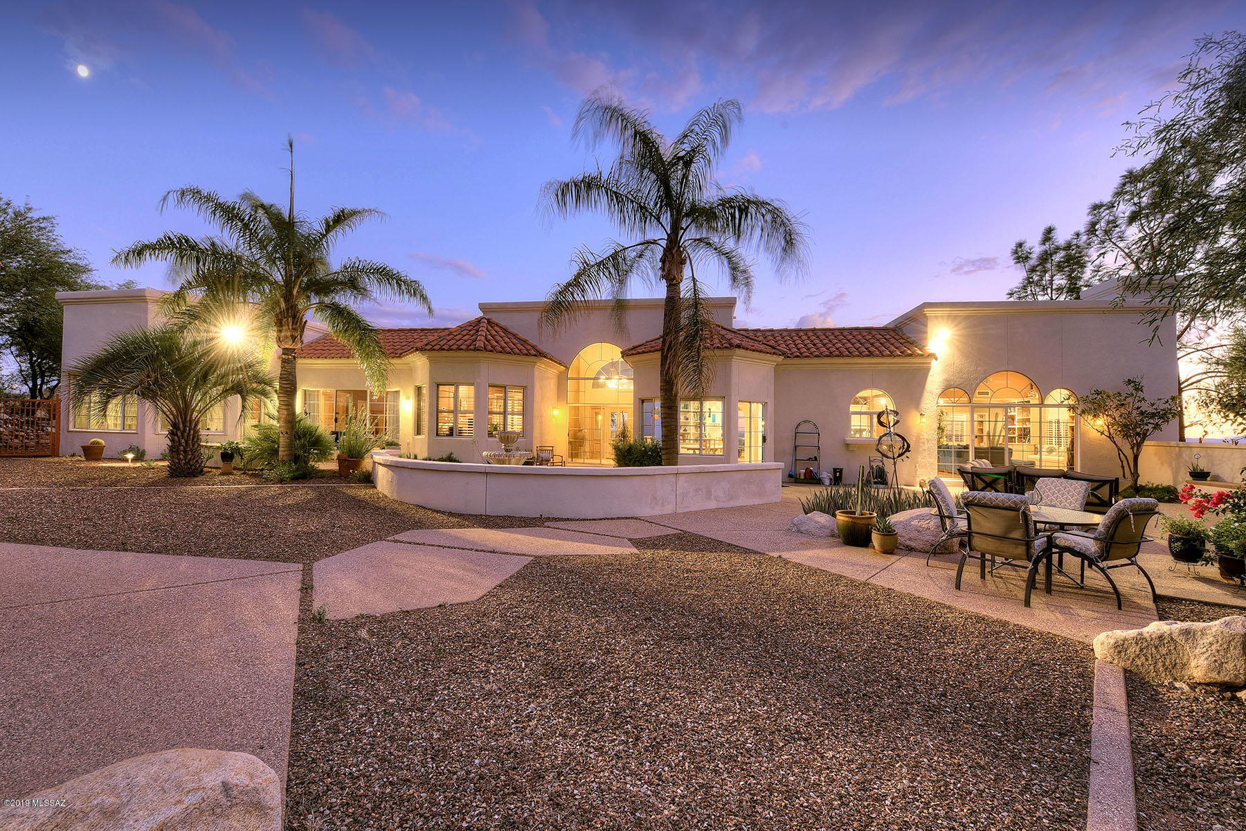 Outstanding Mediterranean/contemporary style home high on a hill in prestigious Alta Vista with sweeping, reach out and touch the mountains and city lights views.  A long and winding driveway leads to this 4 bedroom plus den and office home with 4,266 sq. ft., 3 car garage, on a full acre cul-de-sac lot in the Catalina Foothills and Catalina Foothills School District #16.  Covered entry leads into foyer with soaring ceiling and walls of windows, to living/dining room combination.  Expansive family room/kitchen features fireplace, office space, kitchen with generous cabinetry and countertop space, center island with butcher block counter and breakfast nook.  Gracious master suite has adjacent den/sitting area, garden tub, dual vanities and dual walk-in closets.  Activity room with full bath could be 4th bedroom.  Balconies  with views, professionally landscaped yards, flagstone walkways, fountain, gazebo and so much more make this a must see property.