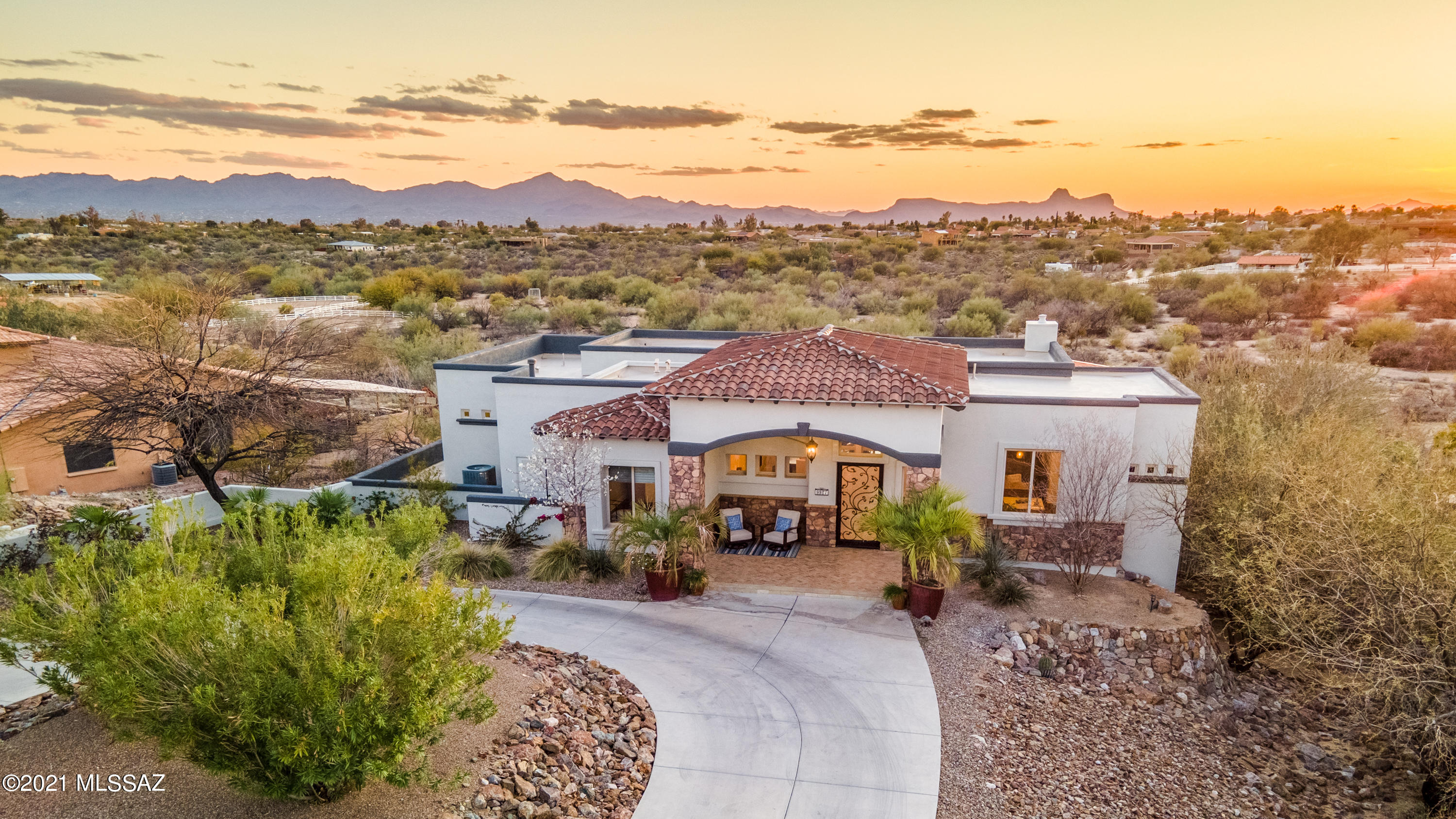 Commanding Elegance | Bring the family home to this never have to leave space that has it all! Wide open space of 3.3 Acres to roam or bring horses to. Spectacular sunsets off your 1000 sq. ft. patio. Upper level offers stunning views & lower level offers a dream vacation setting with large pool, spa, and slide. Retreat to the shade under the gazebo and fire pit next to koi pond.  Inside couldn't be any more perfect if you want ideal spaces to gather - Upper level (main floor) has Kitchen, Great Room, Breakfast Nook, Formal Dining overlooking sunsets, Powder Bath, Master Bedroom, Guest Bedroom (or Office space) and Laundry  Room - Lower Level takes you to a perfectly designed Guest Quarters complete with kitchenette, dining, living room, 3 bedrooms and bonus room which could be a Wine Cellar, Extra Storage, Exercise Room, Etc. Additional 800 sq. ft. patio below outside the Guest Quarters. Quality materials used in this custom home, hardwood floors at upper level, travertine stone, granite countertops and gourmet kitchen appliances.  Home freshly painted inside and out.