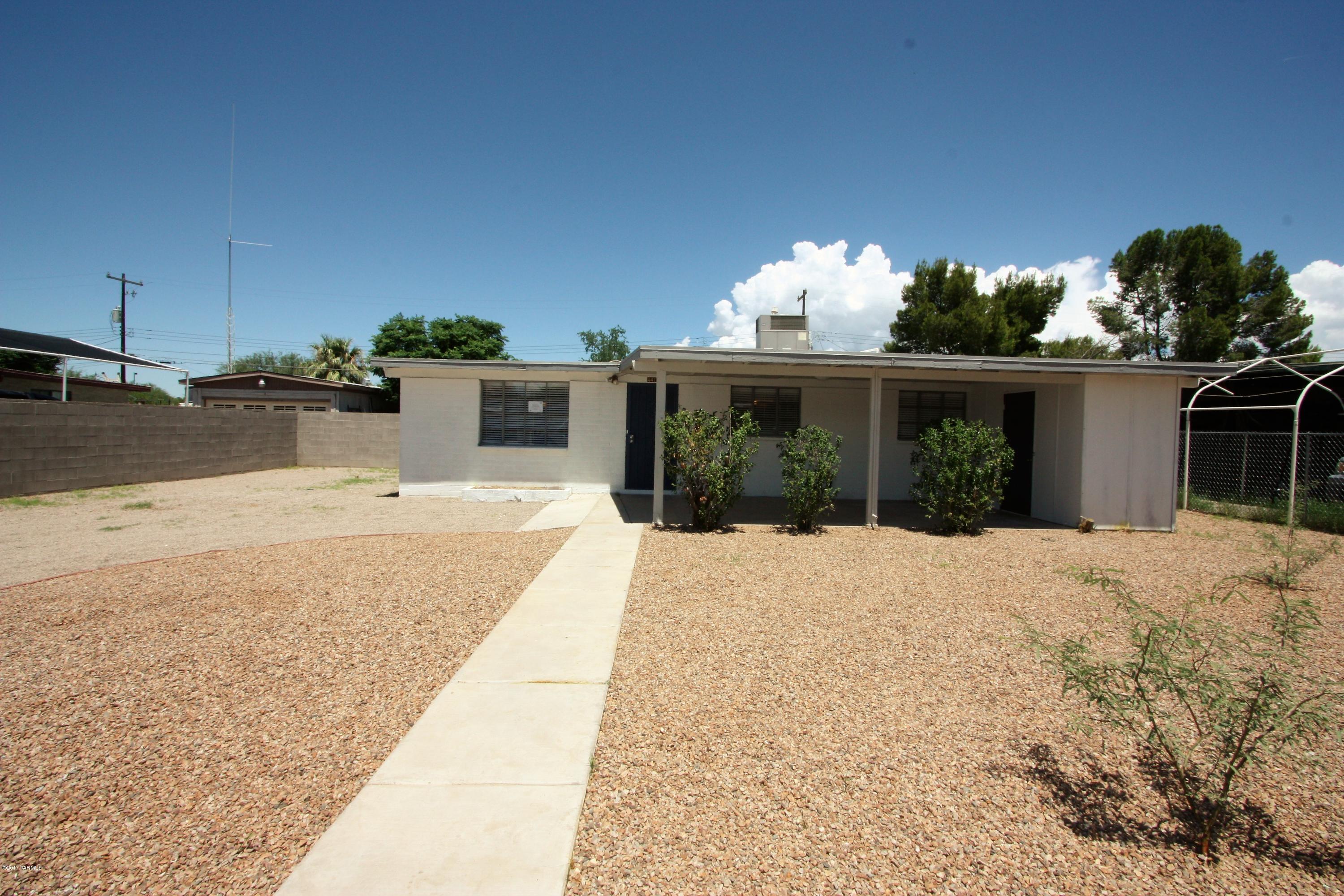 Adorable single family home in Central Tucson. Modern tile shower surrounds, neutral carpet, bright kitchen, chic electrical and plumbing fixtures, 2 tone interior paint  and stylish plank flooring. Walking distance to elementary school and close to Reid Park Zoo. A must see. Agent Owned.