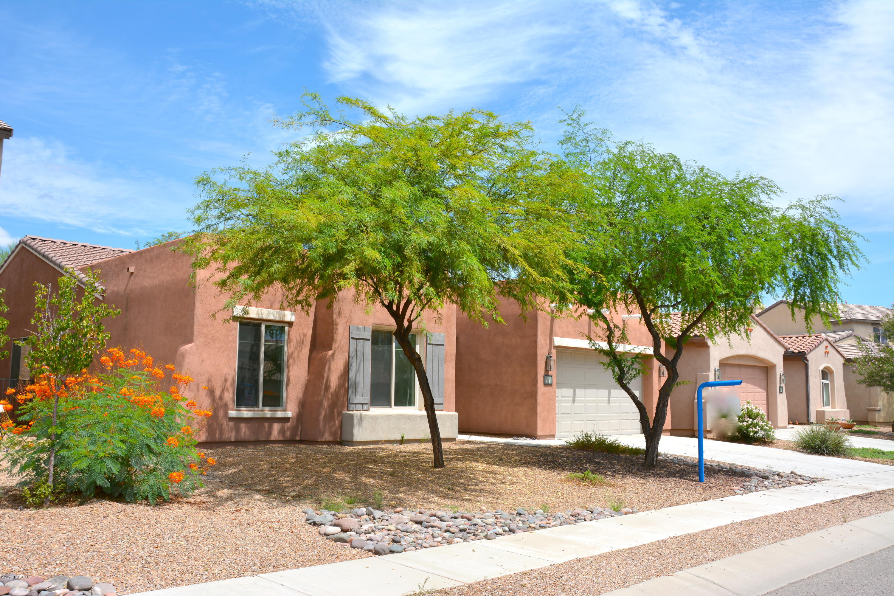 Short Sale Approved at $210,000. Come experience the Resort lifestyle in Rancho Sahuarita, come see this beautiful ''Sahuarita Floor Plan'' home built by Pulte. Offers 4 full size bedrooms, 2.5 bathrooms. This beauty offers a split floor plan, high ceilings, new fresh interior paint all through out the home, new carpet in all bedrooms & living areas, ceramic tile in all common & wet areas. Kitchen offers stainless steel appliances, an executive level dishwasher, a convection/microwave, large size oak cabinets, Corian counter tops. Back yard offers a large mature tree that offers lots of shade, a built in BBQ grill ready to grill, plus a gas fire pit for your outdoor entertaining. This beauty also offers a 3 car garage. Within minutes to the club house, doggie park, grocery store, freeway.