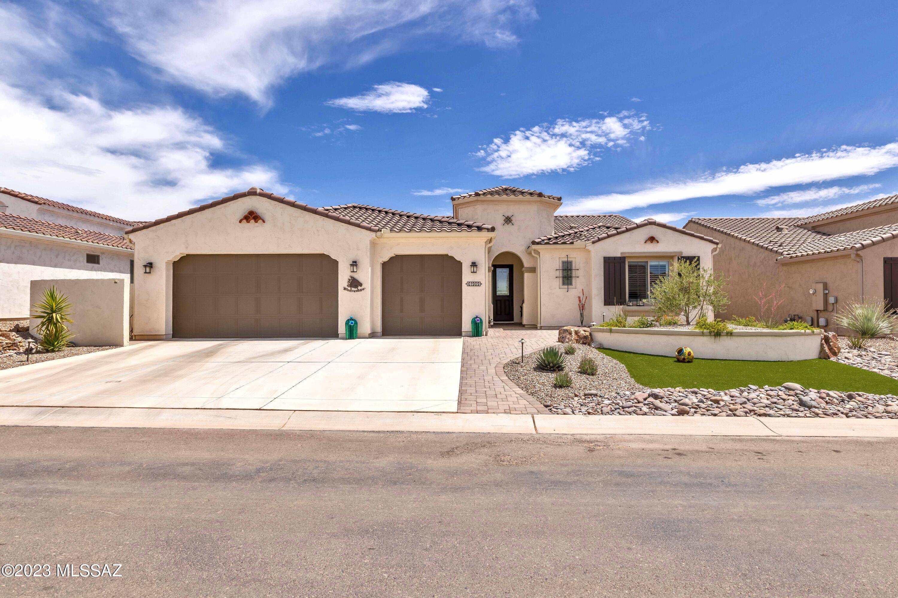 Centrally located in the heart of SaddleBrooke Ranch, this Tesoro floor plan offers tranquility & space to make you feel at home! Chef's kitchen offers a generous island, upgraded quartz countertops, designer backsplash and upgraded Stainless Steel appliances. The tranquil primary suite is spacious and boasts a lavish bath with double vanity sinks, spa like walk-in shower and two separate walk-in closets with custom cabinetry. Split floorplan features an inviting guest bedroom with an en-suite bath for your guest's privacy. Multi-Purpose den can be a TV room, a craft room, or an office if desired.  Expanded full 3 car garage has an overabundance of storage and plenty of room for your cars, golf carts and other toys. Completed in 2021, this home is expanded in all the right places. The covered patio with cozy gas burning fireplace includes custom roller shades leading to the spacious yard beautifully landscaped and fully fenced. This home has everything you would ever want to live the best desert lifestyle. Don't wait to live the dream.