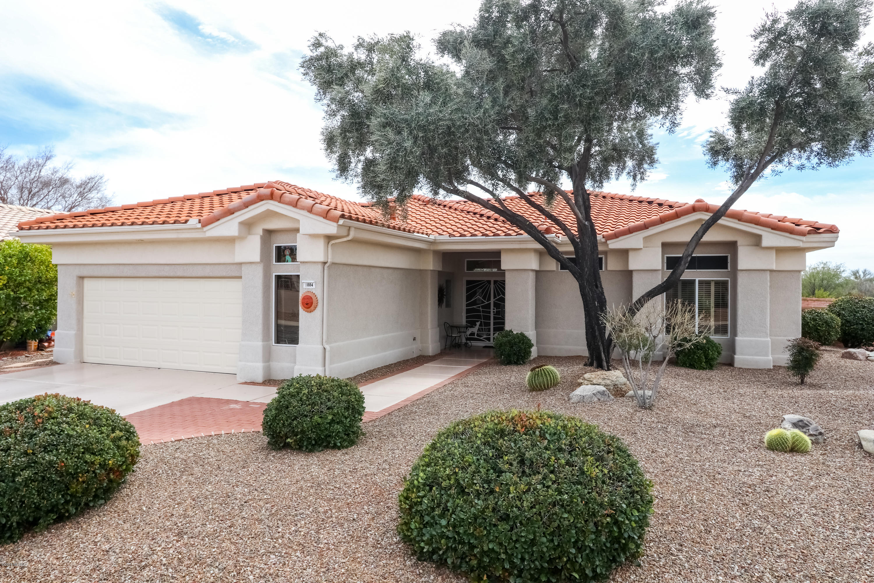The view will knock your socks off! Relax in your beautifully landscaped back yard & watch the sunset, sunrise & the sunset again... without getting up from your chair! Coveted, premium SCOV lot w/view of Catalinas, Pusch Ridge & Tortolitas. Expanded Sunrise Plan (1766) w/elegant double-door entry & brick patio in back. Nearly everything has been beautifully updated: quartz, cooktop, tile, HVAC and roof are almost new. Dishwasher new last week! Giant master suite w/double door entry, walk-in closet, garden tub, shower, double sinks. Lay in bed and gaze at the pink mountains from your secluded /private window. Plantation shutters everywhere. INDOOR laundry room w/2 closets, sink & cabinets. Extra-wide garage, w/room for golf car. And oh yeah... did I mention the spectacular view?