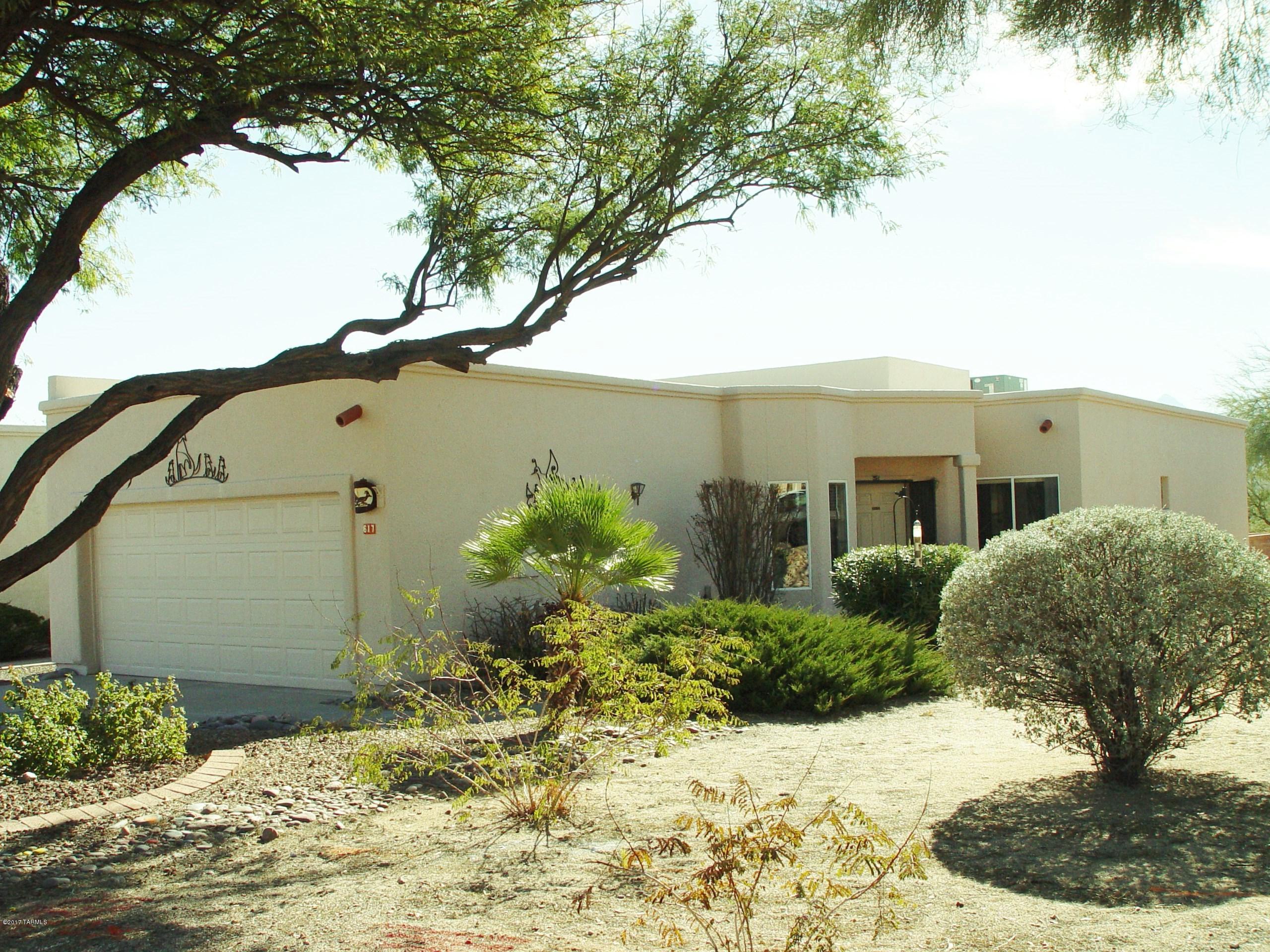 This end-unit townhome in SpringPointe has high ceilings and several clerestory windows which give a light and airy feeling as you step into the home. Continuing through the home onto the back patio, you get a view of the Santa Rita Mountains plus the privacy and buffer of the surrounding common space and wash. A nice size master with a walk-in closet also boasts exterior automatic rolling blinds for the warmer days in Green Valley. A lovely wood fireplace accents the spacious living area. An efficient galley kitchen boasts a large pantry closet and newer appliances. A nice feature of the kitchen is the eating area in the bay window where sunshine creates a happy space any time of the day. This Dorn-built home is priced to sell so that you can put your own personal touch on it.