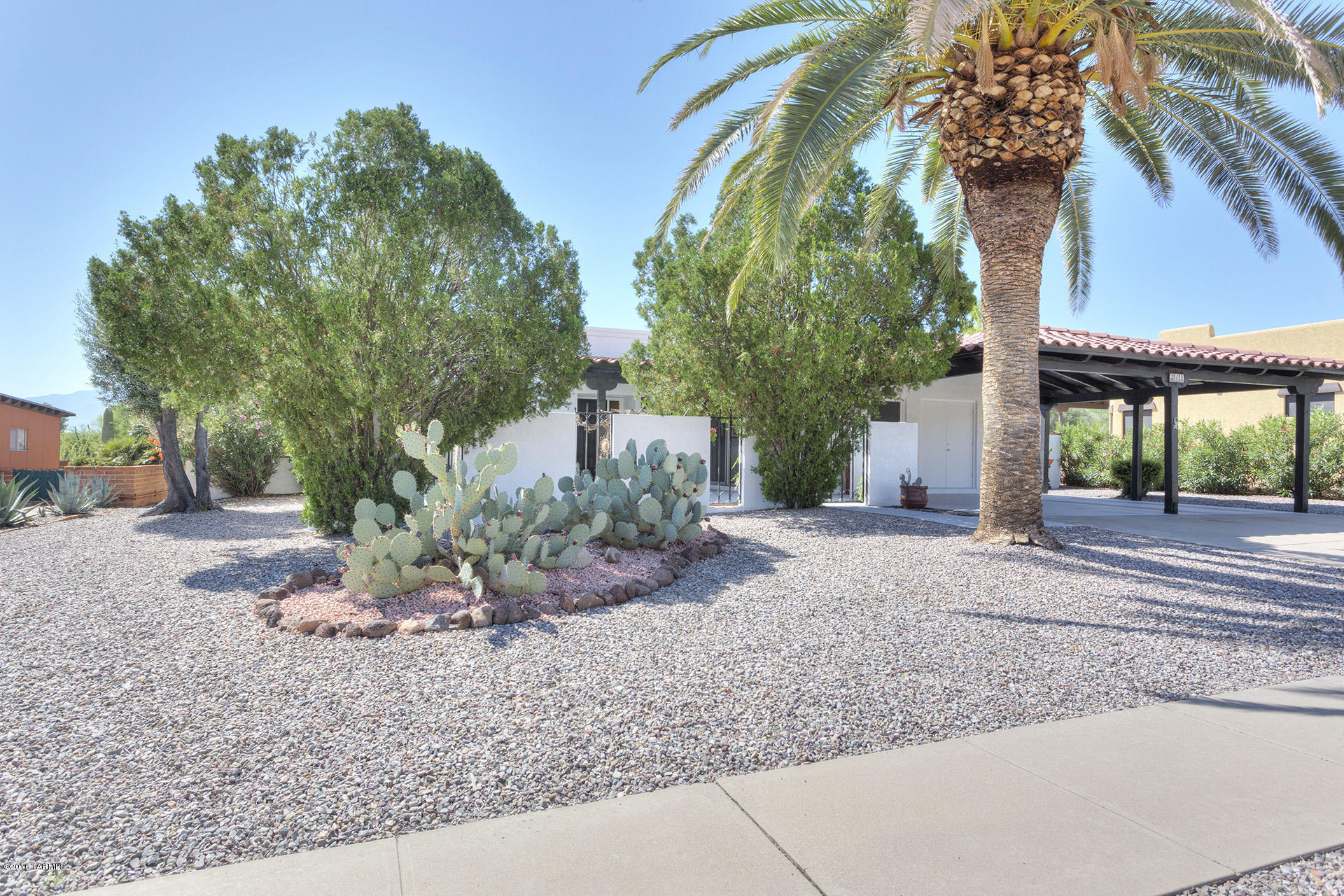 ''Charming'' is the word that describes this well maintained single family home.  From the moment you enter the front courtyard, you will be drawn into the serenity that only this hacienda style construction can offer.  But wait, this home has so much more to offer.  Fully furnished with beautiful Mexican tile in the main living area, many updates have been added making this property move-in ready.  All you have to bring are your personal items, and you're ready to enjoy SW living at it's best.  Updates include newer kitchen appliances-2014,new W/D-2016,KS tempurpedic mattress-2014,roof re-coated and re-tiled-2016,dual pane windows on south, east and west windows-2016, and tile floors in kitchen, utility room, both bathroom and master bedroom-2016. HOA dues only $35.00 annually. A must-see