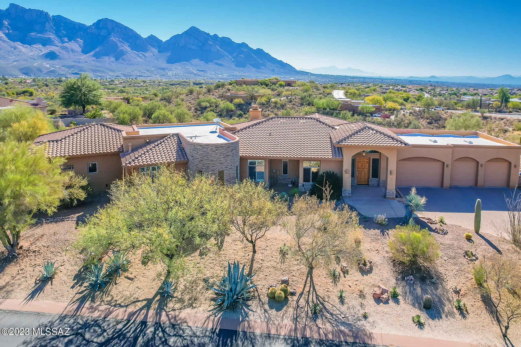 Stunning Catalina Mountain views!!!  Truly beautiful contemporary home 3 bedroom 3 bath plus exercise room and office. Expansive gourmet kitchen with granite counters, center island, stainless steel appliances & wine cooler. Wood beam ceiling in formal dining (currently pool table room) and great room with fireplace. Large master with sitting area and fireplace. Entertainers delight with pool, spa, fire pit and built in BBQ overlooking amazing views. Huge four car garage!