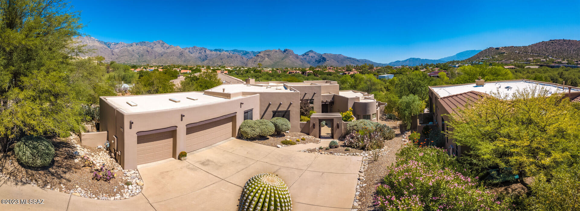 This jaw dropping showpiece delivers charm, sophistication, and panoramic Catalina Mountain views that will leave you breathless. Nestled deep in the quiet, gated community of Ventana Ridge, this renovated, move-in ready, split bedroom floor plan home is an indoor and outdoor paradise. This 4-bed/3-bath home features a massive primary suite and perfectly appointed MIL suite. Desert modern design with concrete floors and neutral tones throughout. Kitchen is open concept overflowing with quartz & stainless steel appliances. 14-foot ceilings extend through the great room & sitting areas. The bathrooms feature custom walnut vanities, high end finishes, and even tadelakt plaster.  Manicured outdoor space complete with a recently refinished pool, new turf, and views that will melt your heart.