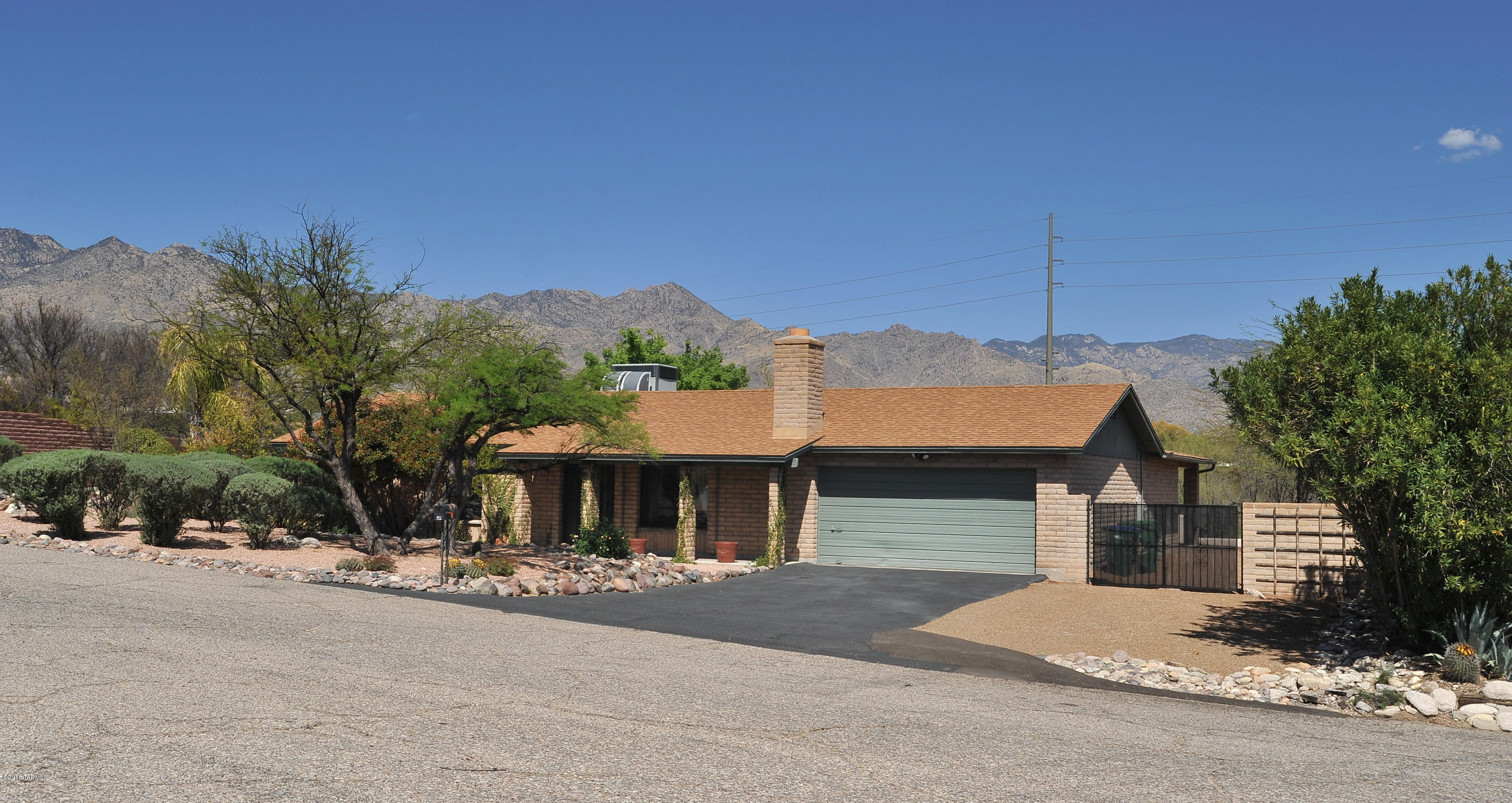 Spectacular Catalina Mountain Views! Wall of windows off the family room allows for unobstructed mountain views & additional privacy backing to common area with lush desert,The privacy gives you a feel of being on over an acre. home is full of charm featuring wood flooring, wood doors, beehive fireplace, French doors & vaulted ceilings. Large dining area & cozy family rm. Open kitchen features views, stone countertop w/wrap-around bar seating & stainless steel appliances. New Low E windows, Large master suite offers a French door to the pool,walk-in closet,bright & open bathroom with soaking tub & tiled surround. Entertain in this backyard featuring ceiling fans, oversized vaulted covered patio that wraps around to the pool area. Dist 16 schools,close to shopping,resorts and sabino canyon.
