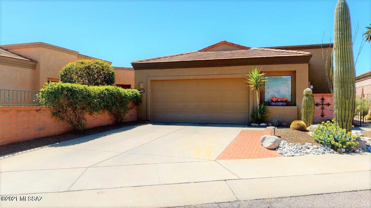 From the southwest plantings along the walk to the front door to the mountain views from the back yard, this 1,771 square foot home is a delight. Its open foyer leads to the living room with a cozy fireplace.  The kitchen with granite countertops has ample space with a large eat in area which easily flows to the Arizona room with views to the south and east mountain range.  Sunsets from the kitchen and Arizona room and back yard are spectacular. Master suite features  a large bedroom, spacious closets and bath with double vanity and travertine countertops.  Guest bedroom and hall bath are conveniently located close to the kitchen.  Small office area is located next to the garage entry.   Major mechanical upgrades in 2019 were roof coating, a new HVAC system and all plumbing changed to Pex.