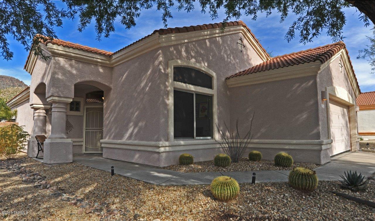 Stunning unobstructed Mountain Views! Incredible home meticulously maintained. Tall ceilings & high windows create wonderful architecture & features beautiful slate stone flooring & designer paint, decorative ceiling fans, recessed lighting & custom window coverings throughout. Spacious great room off the kitchen offers a fireplace enjoyable from all living areas! Kitchen includes an island, roll-out drawers, stainless steel appliances including the refrigerator, under cabinet lighting & gorgeous quartz countertops! Master features views, 2lg closets, dual vanity & walk-in shower are custom tiled. Private backyard w/breathtaking Mnt views & desert buffer, located on 2nd fairway of AZ National Golf Course! Extended flagstone patio plus retractable awning, grass area & mature landscaping!