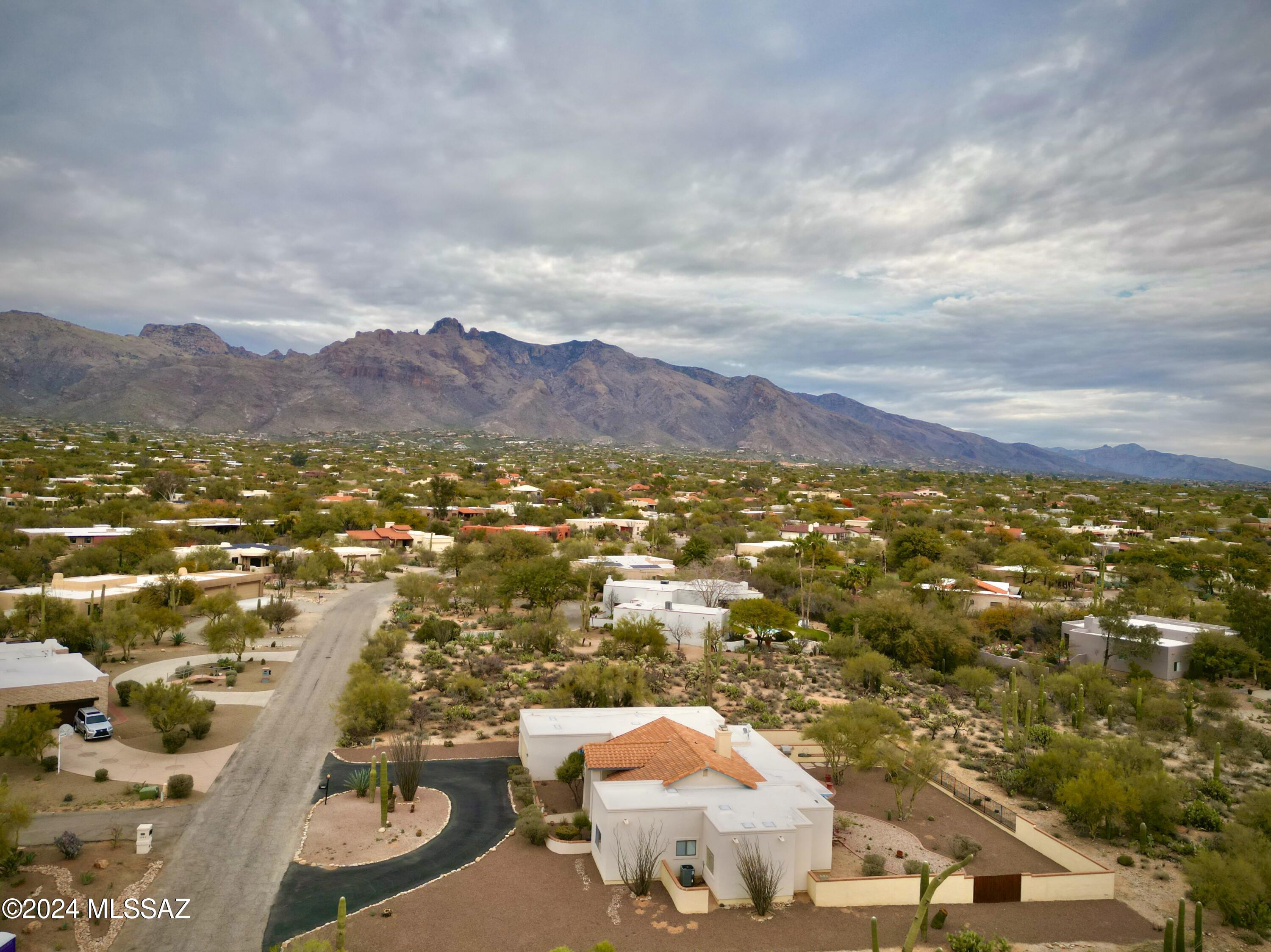 If you are looking to add your personal touches to an impeccably maintained home, your search is over. Located in one of the most well know and sought after foothills communities, Shadow Hills, this home has so much to offer. You are welcomed by a spacious circular drive, and as you enter the home you will find a thoughtfully split 4 bedroom 3 Bath floorplan, complete with a spacious kitchen, two dining areas, and separate living areas, each with a fireplace. The home is ideally placed with an east facing backyard on just shy of an acre, offering spectacular mountain views. The rear portion of the lot is a blank slate and providing space to add a guest house, pool, or for fitness activities. Priced aggressively to allow you to budget for upgrades that meet your personal taste. and lifestyle. If you are an informed buyer who has been watching the market, you recognize the value and opportunity. Some upgrades include rolling shades, a recently updated HVAC system, and exterior Dryvit stucco upgrade for enhanced moisture protection.