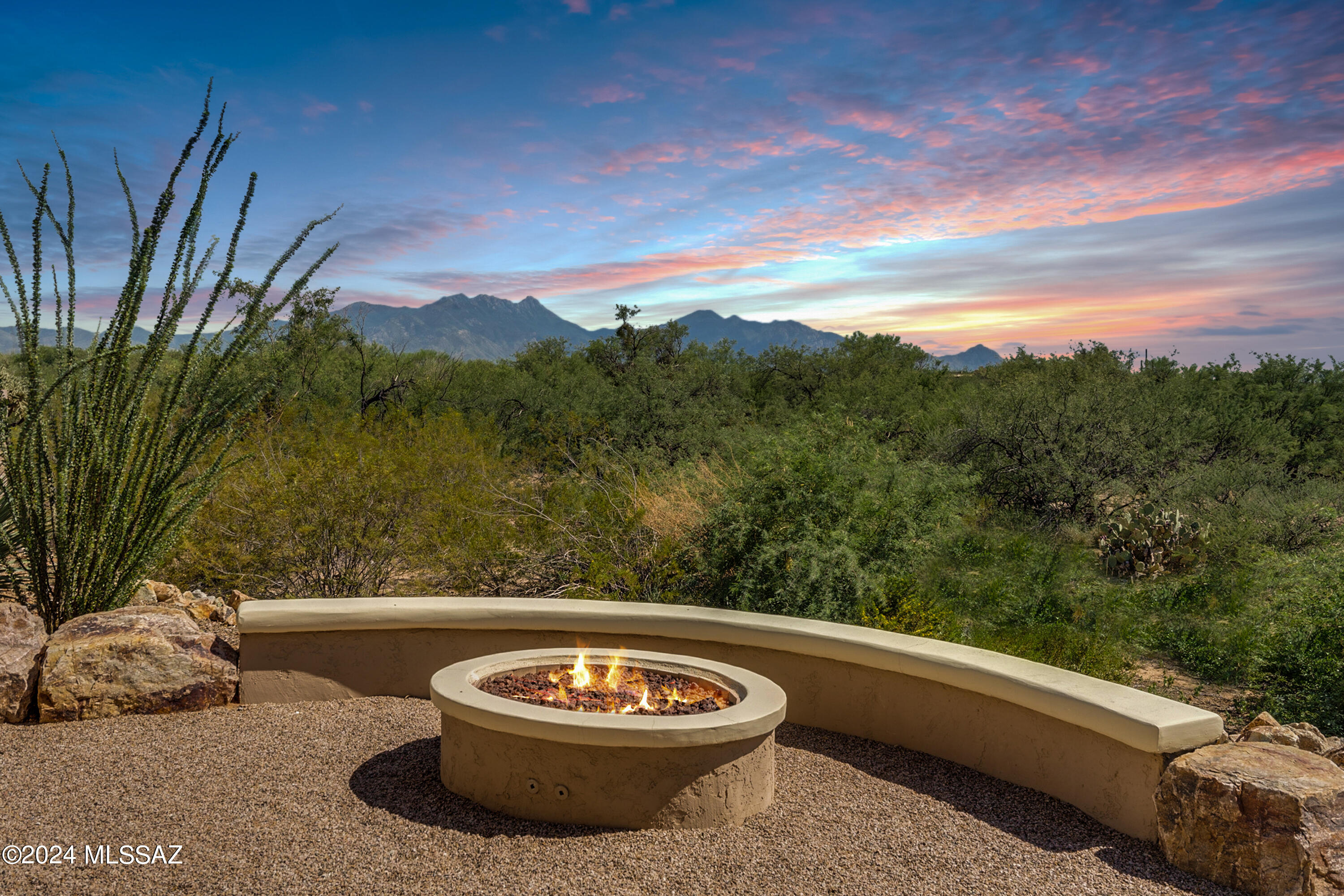 Breathtaking views! Located on a highly coveted street in Quail Creek, this 2013 Sonata model w/ Casita offers 2,821 total sq.ft., incl. 3 BR, 3.5 BA, Den and multi-purpose room. Wonderful curb appeal w/ gated front courtyard, stunning wood entry door. Inside are soaring 12' ceilings in the kitchen, great room and dining area, crown moulding, upgraded lighting and hand scraped hardwood flooring in the common areas. Kitchen has a grand island w/ granite counters, upgraded cabinets, stainless appliances, 36'' gas cooktop. Expanded Owner's Suite w/ box bay window, exit to patio, dual vanity bath, walk-in tile shower, huge walk-in closet with doors at both ends. Guest BR and private Casita both offer en suite baths. Den offers an ideal space for work or hobbies, w/ built-in desks and storage. Front multi-purpose room can be used for formal dining, game room, quiet reading nook or 2nd office. Separate powder room for guests, 5" baseboards, 8' doors throughout, rain gutters. Laundry has additional cabinets for added storage. Plus extended length garage w/ golf cart bay. Dine alfresco under the extended covered paver patio, or gather around the fire pit and enjoy the peaceful and serene rear yard, backing to natural desert space with spectacular views of Mounts Wrightson, Hopkins and Elephant Head, and the occasional visits from neighboring wildlife. This home has it all!

Come enjoy resort living at Quail Creek, a gated, active adult community offering a wide variety of centrally located resort-inspired amenities including: three 9-hole championship golf courses, a driving range, putting green and pro shop. Plus, 32 pickleball courts, swimming pools, fitness center, arts and technology center, tennis and bocce courts, restaurant and bar, clubhouse with coffee bar, library, billiards, ballroom, conference center, dog park, and dozens of social clubs and activities. The new Quail Creek Canyon Club opening November 2024 will add additional pools, fitness center, bistro and more.
