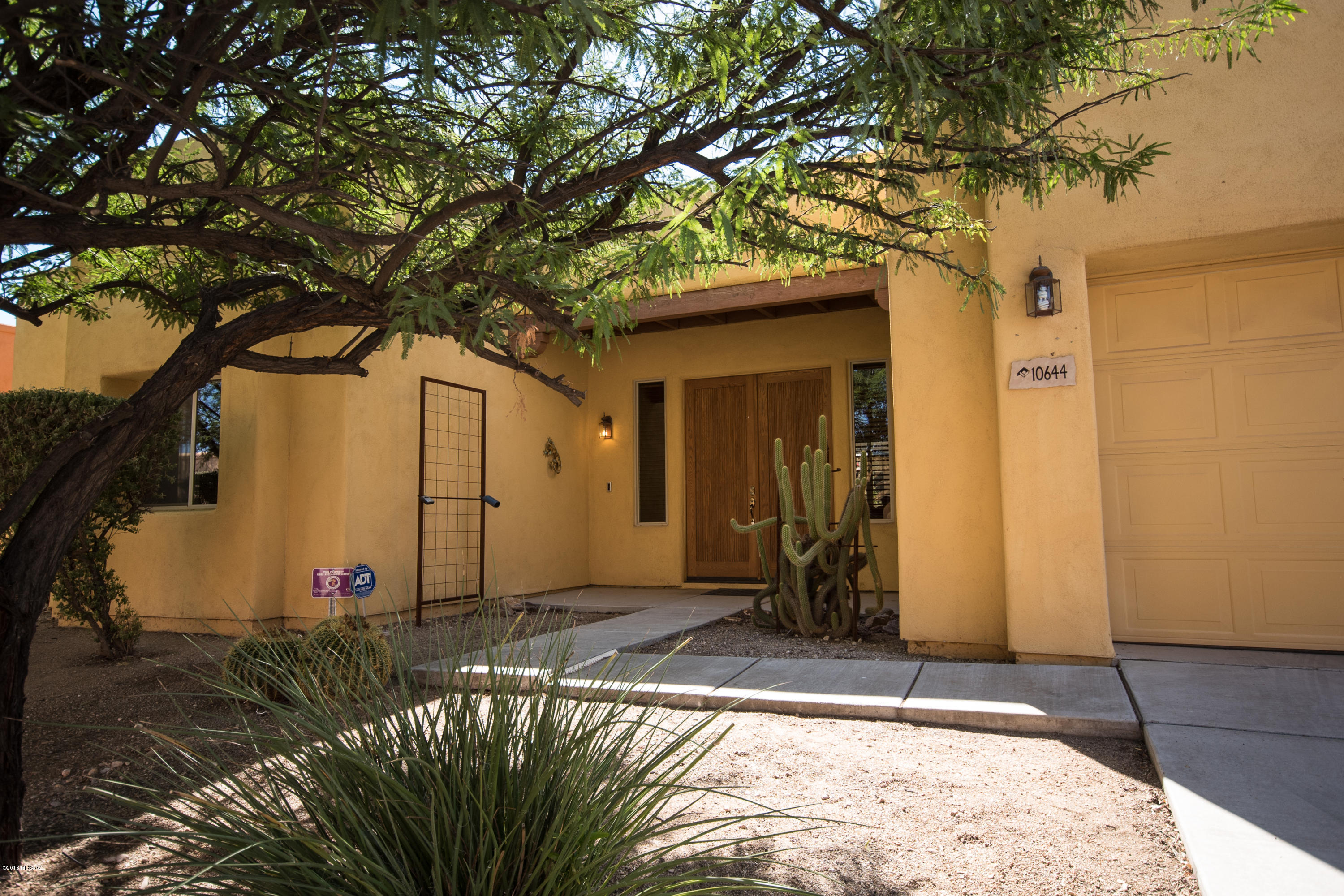 Built by award winning Pepper Viner, this charming 3 br, 2 bath, ranch style home features a beautiful gourmet kitchen with granite countertops, upgraded cabinets, gas range w/elec oven and scored concrete floors throughout. The master suite includes walk-in closet, separate shower, and garden tub. You're only steps away from a peaceful desert pathway via gate access from the pony-walled backyard. 3.8kwh solar electric installed in 2017 reduces elec costs to under $23/mo for current owner. Gas water heater supplemented by a solar water heater. Irrigation system supplied by grey water. Neighborhood amenities include swimming pools, basketball court, soccer field and fitness center. Come see all that this home has to offer in the highly sought after Civano community.
